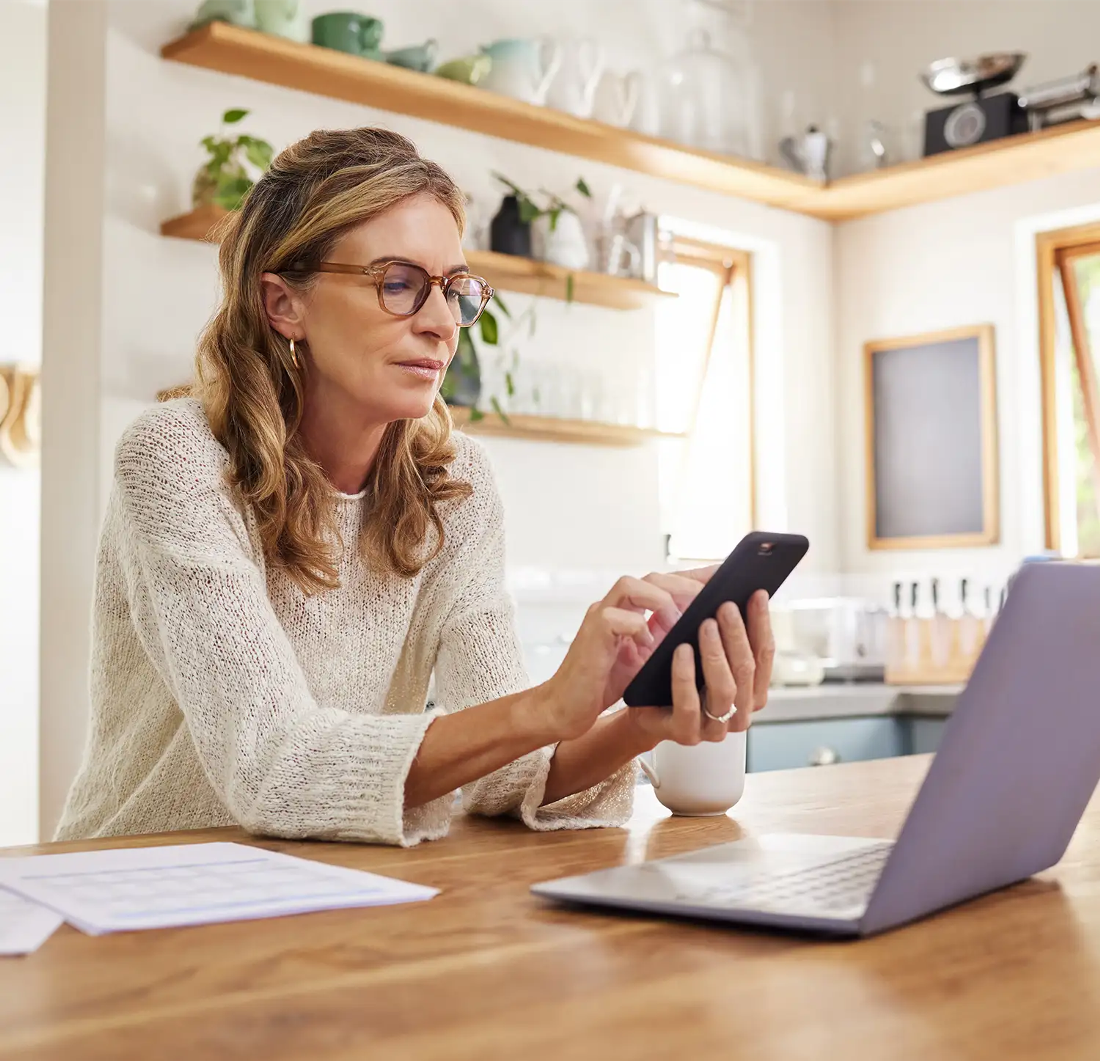 Woman checking her finances at home
