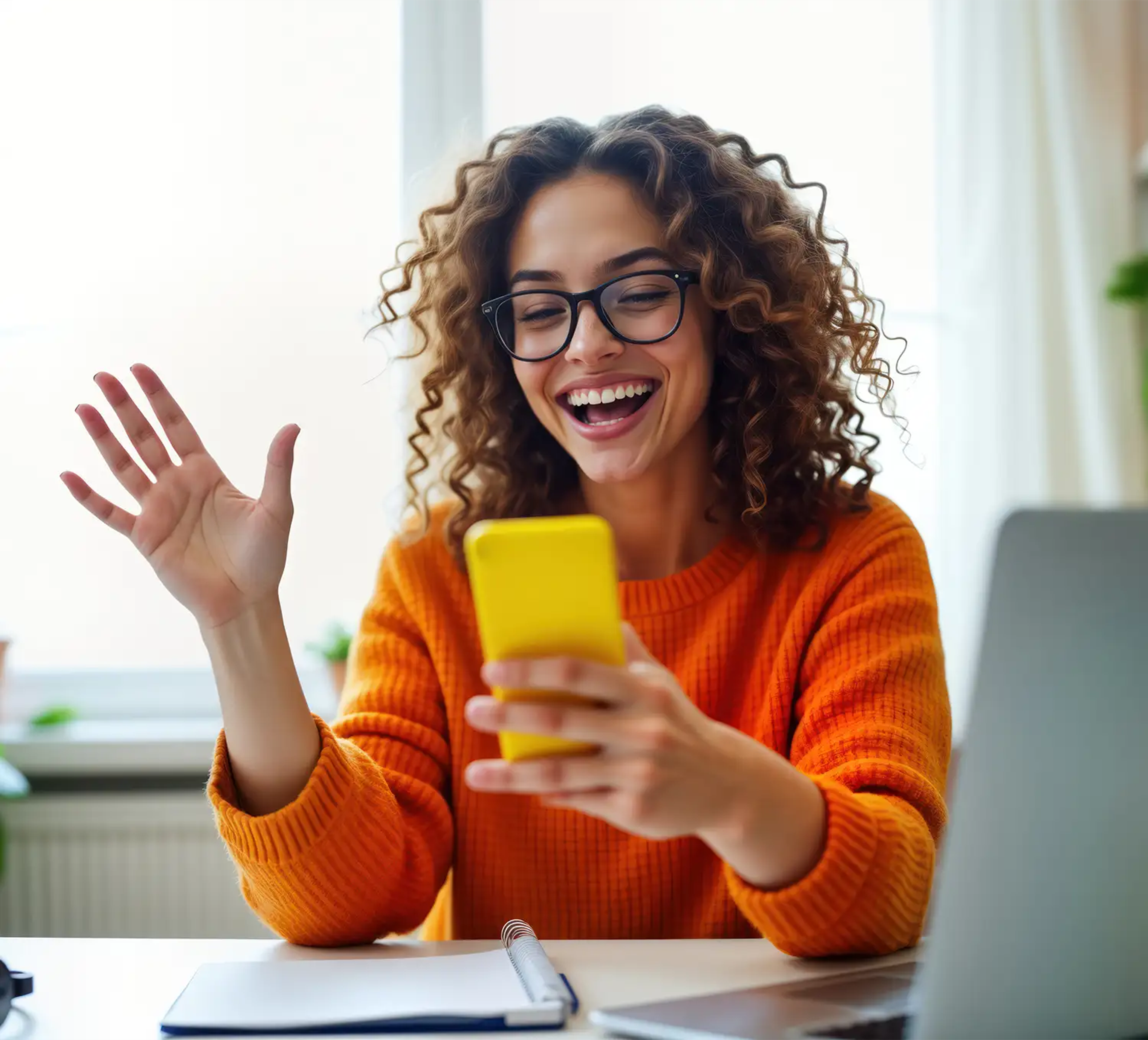 Happy woman checking her mobile for her loan approval