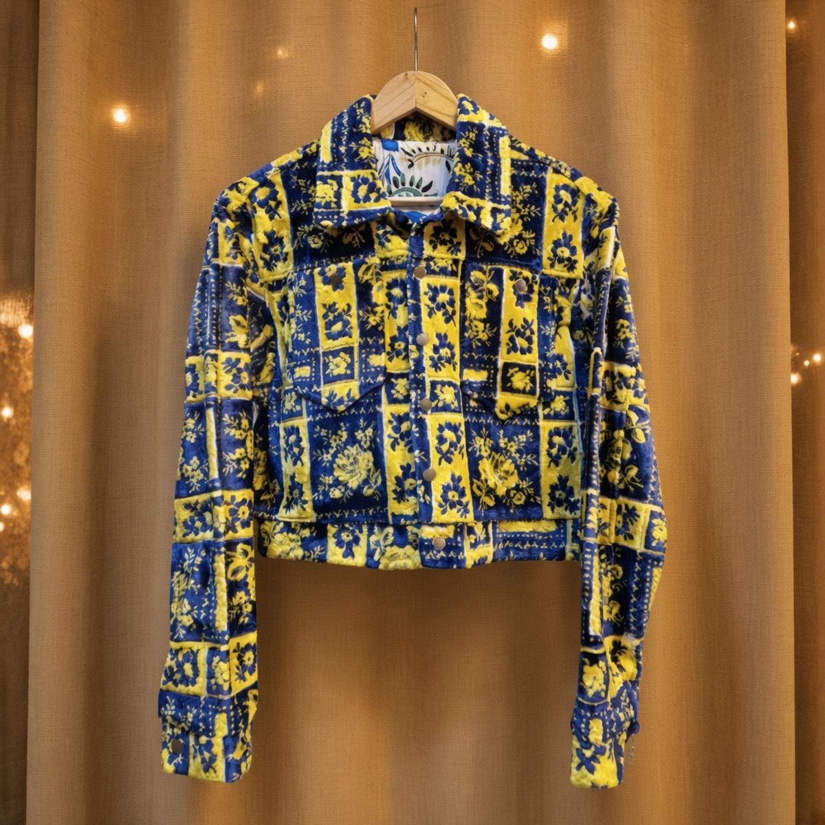 JKT-007 handmade jacket on a warm gold textile background
