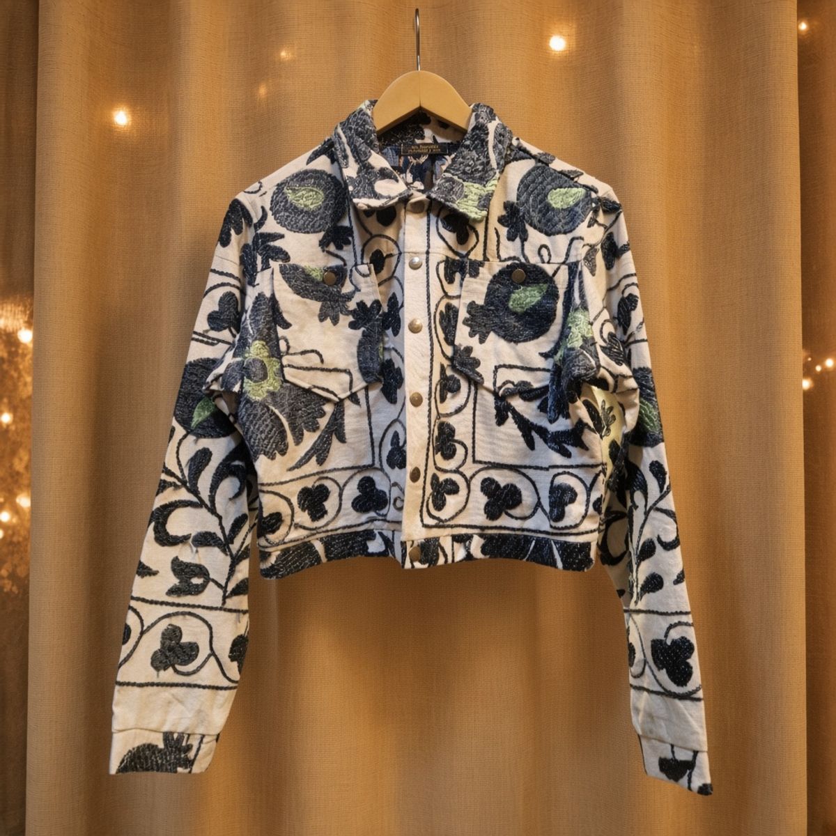 JKT-008 handmade jacket on a warm gold textile background