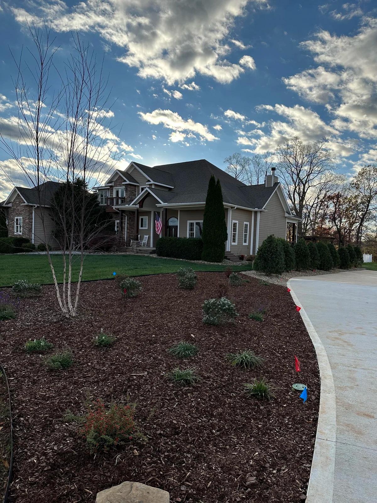 Beautiful home with landscaping and hardscaping that perfectly captures its beauty