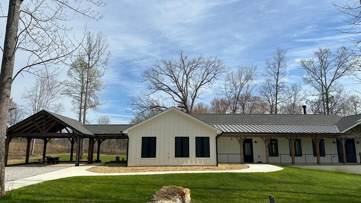 Home with a nicely cut and green lawn