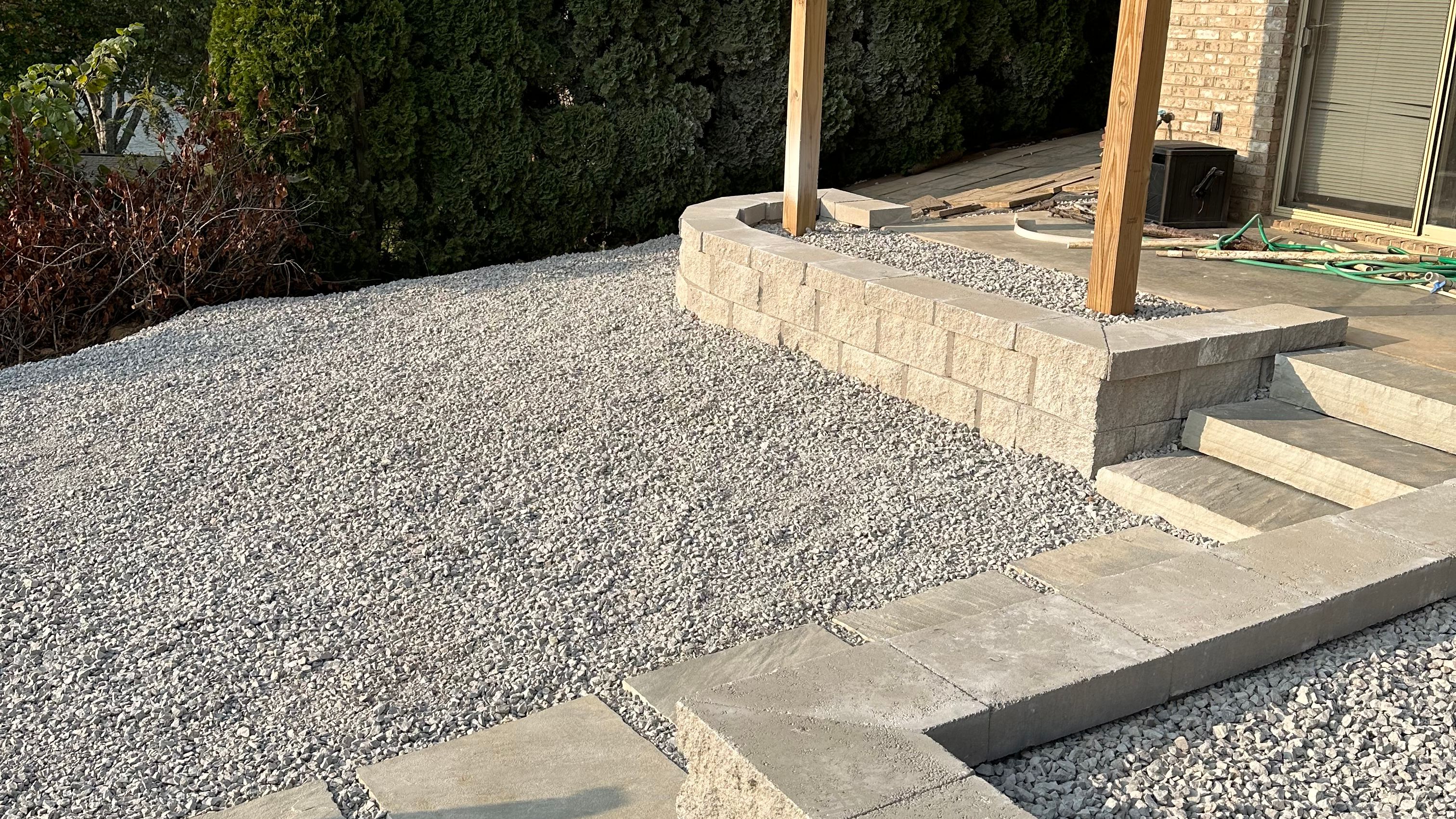 Newly installed retaining wall in backyard