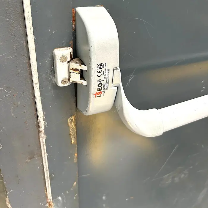 White push bar on the door of a business premises