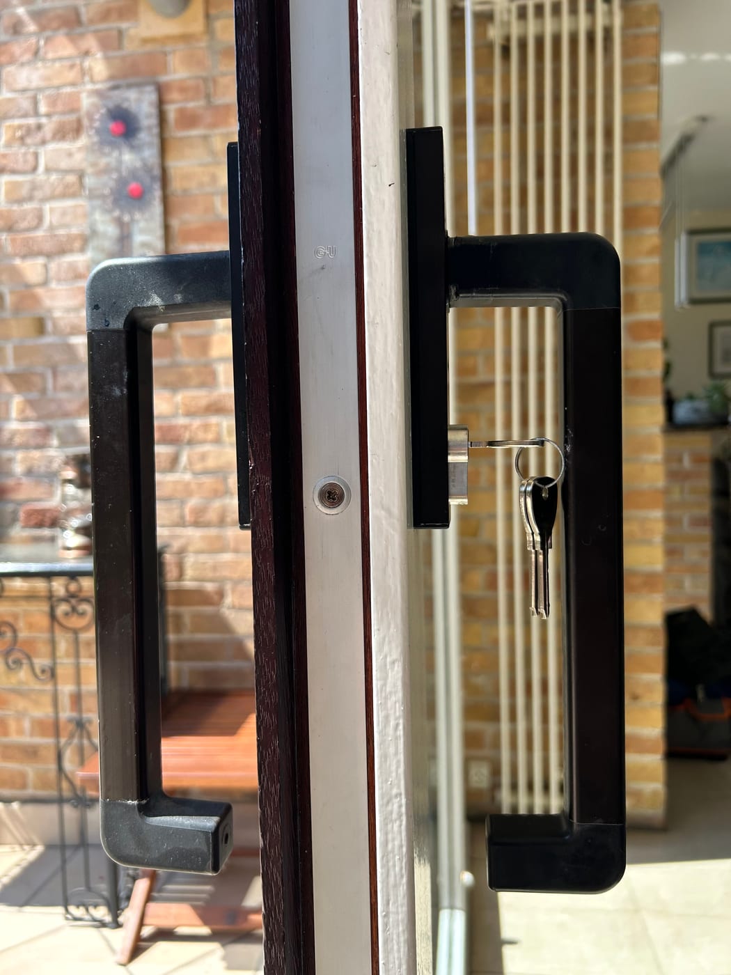 Glazed door with black handles, seen from inside