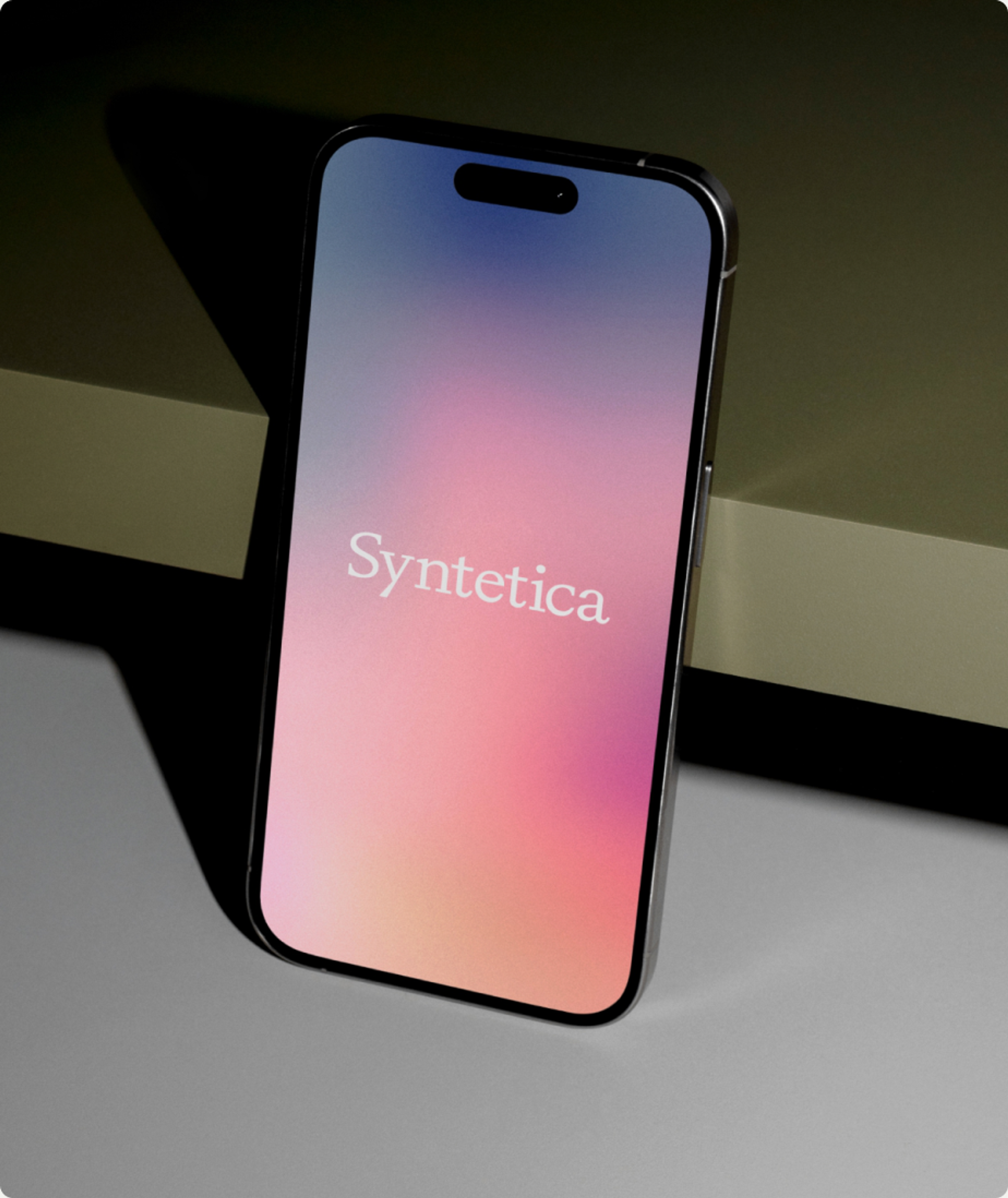 Syntetica site shown on a phone against a dark backdrop