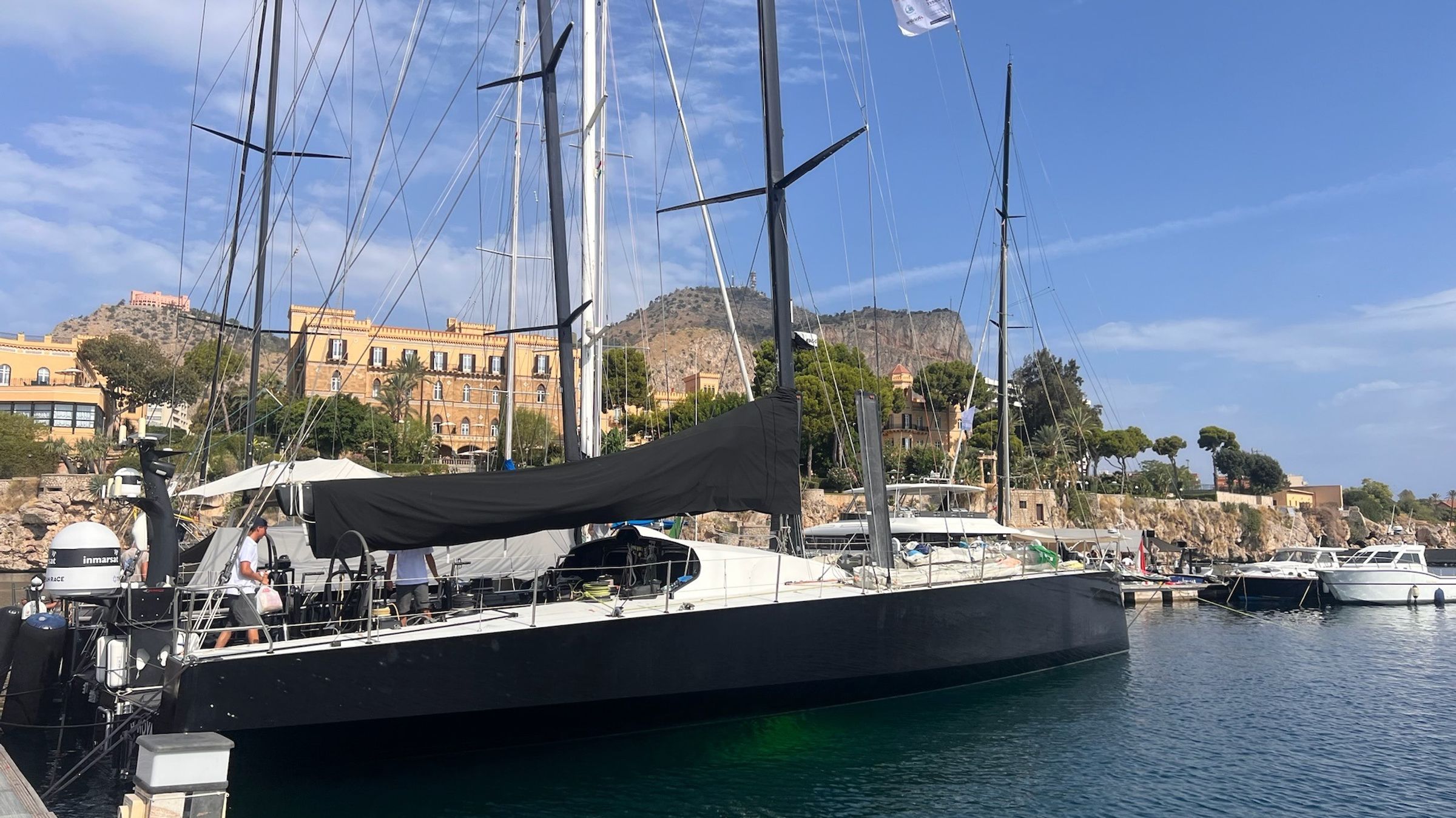 The yacht alongside in Palermo, the city behind