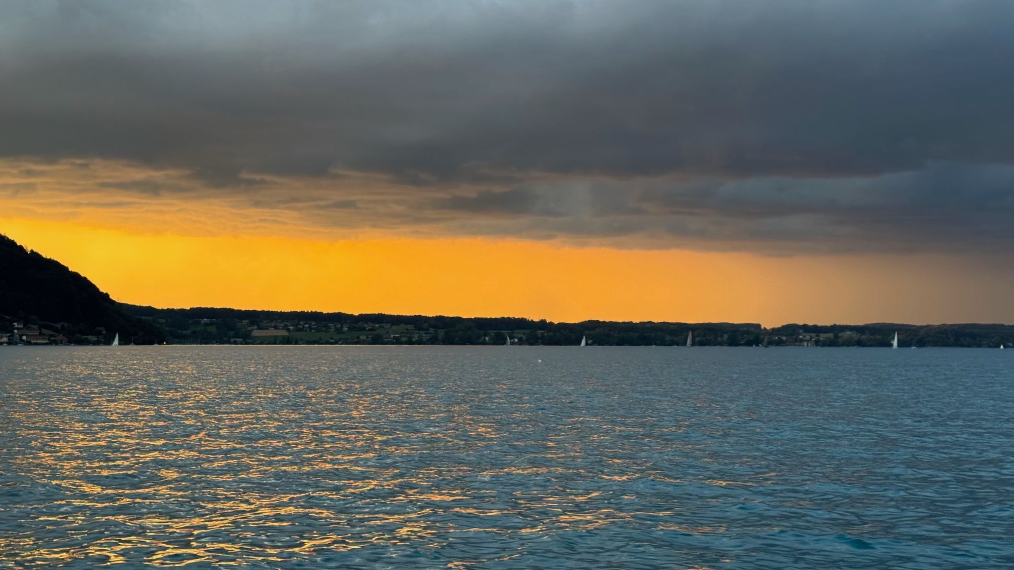 Sunset over Lake Attersee, the mountain ridge in silhouette