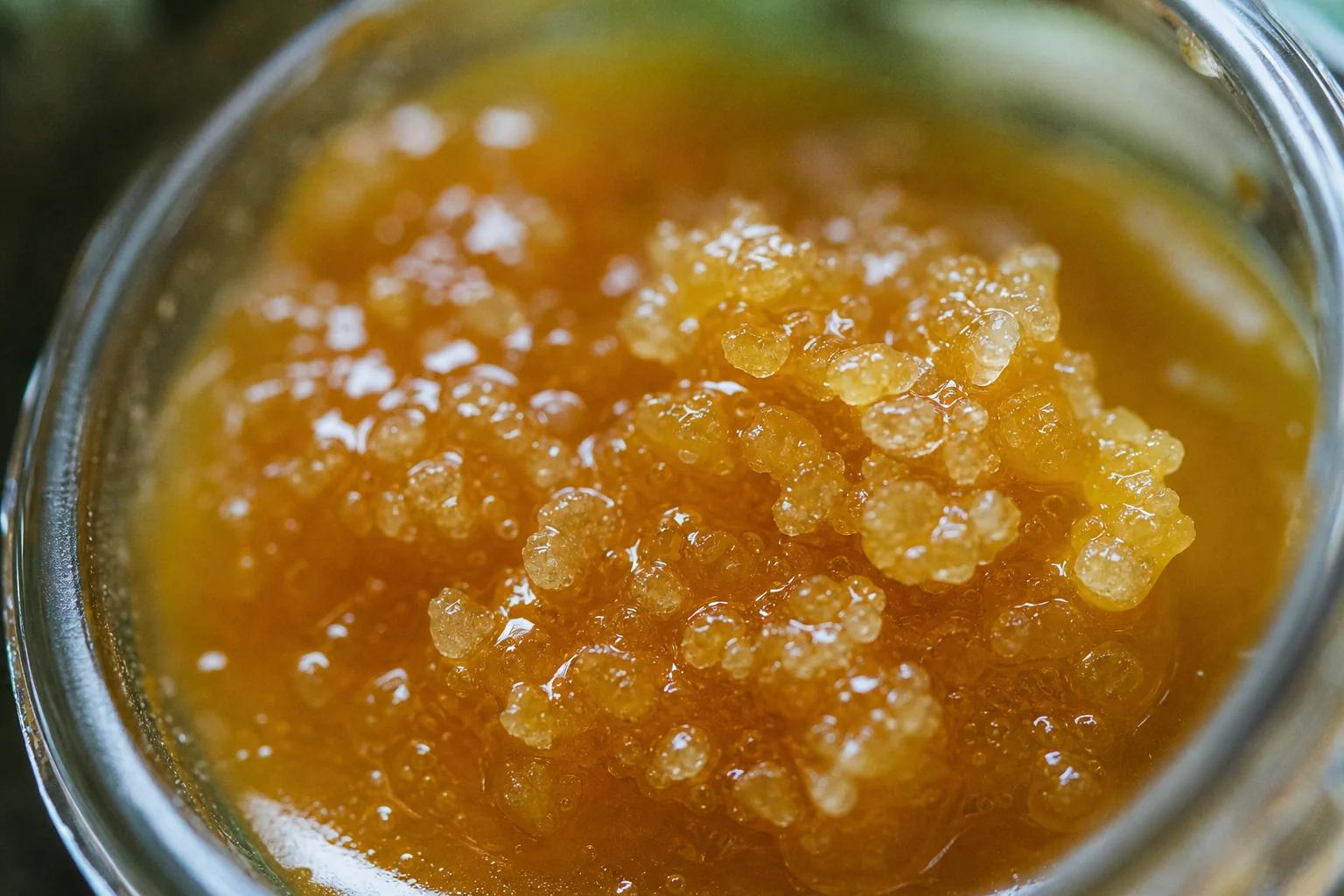Macro of live resin cannabis sauce with THCA diamonds