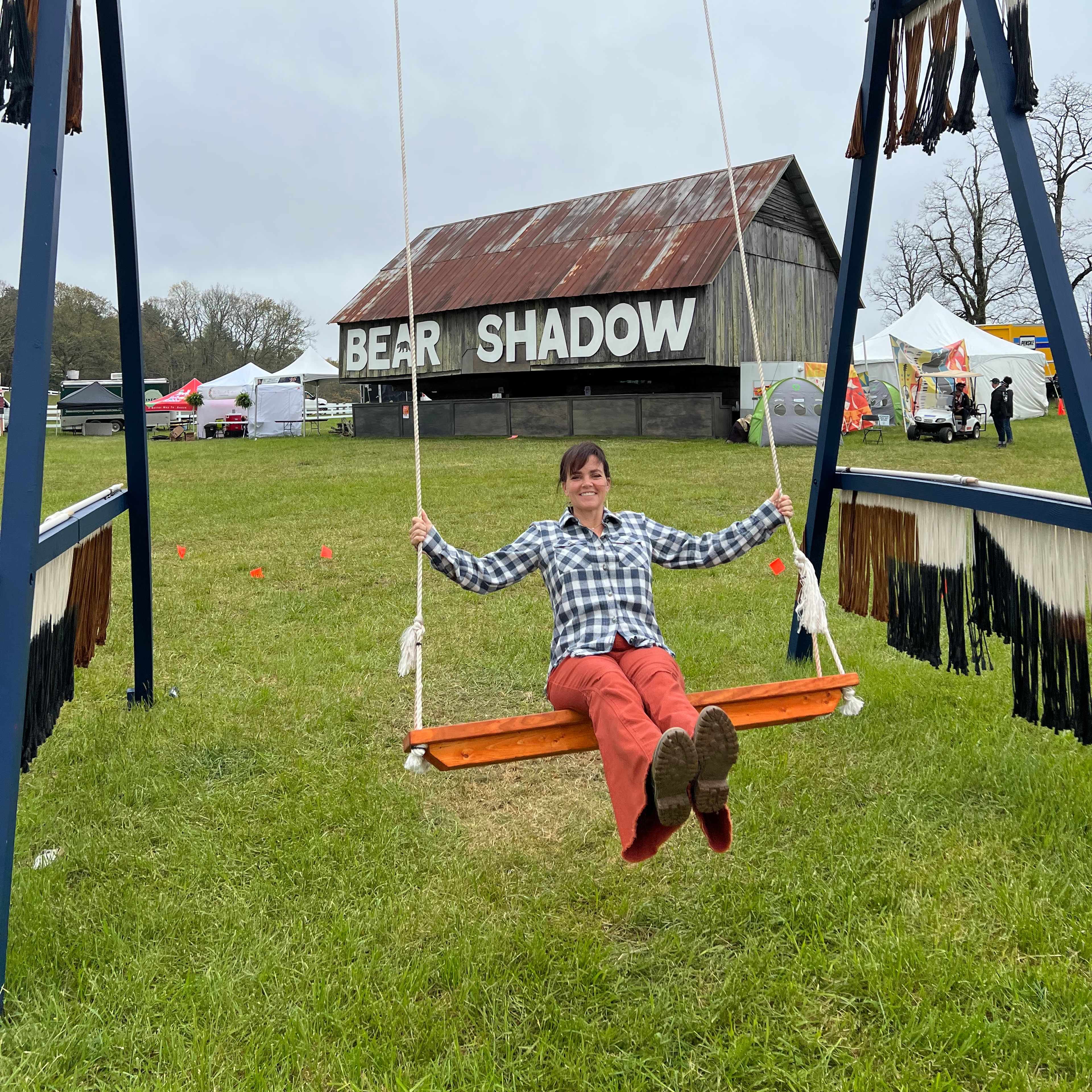 Libiss Skinner swinging on a swing at Bear Shadow 