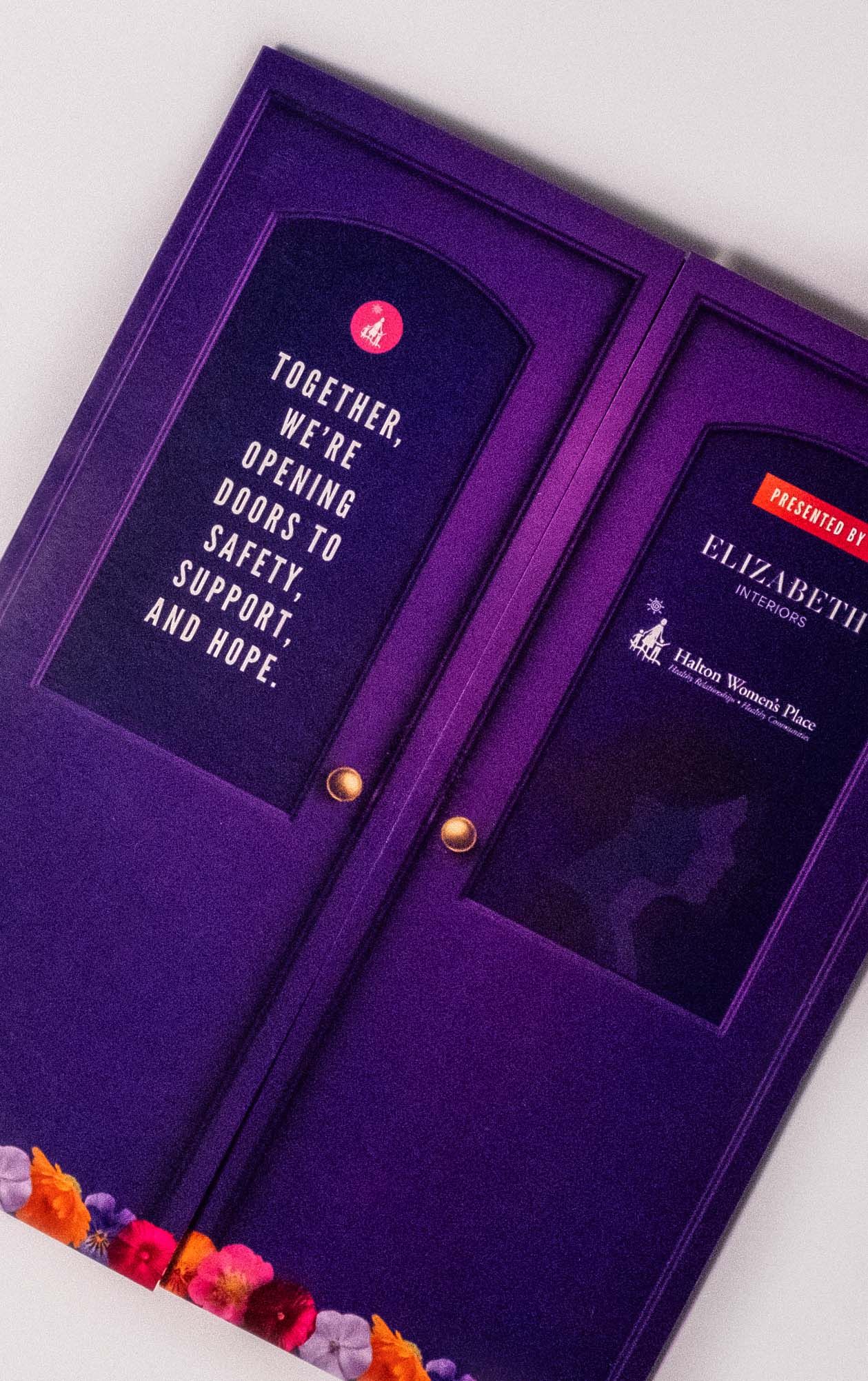 Purple presentation folders produced for Halton Women's Place.