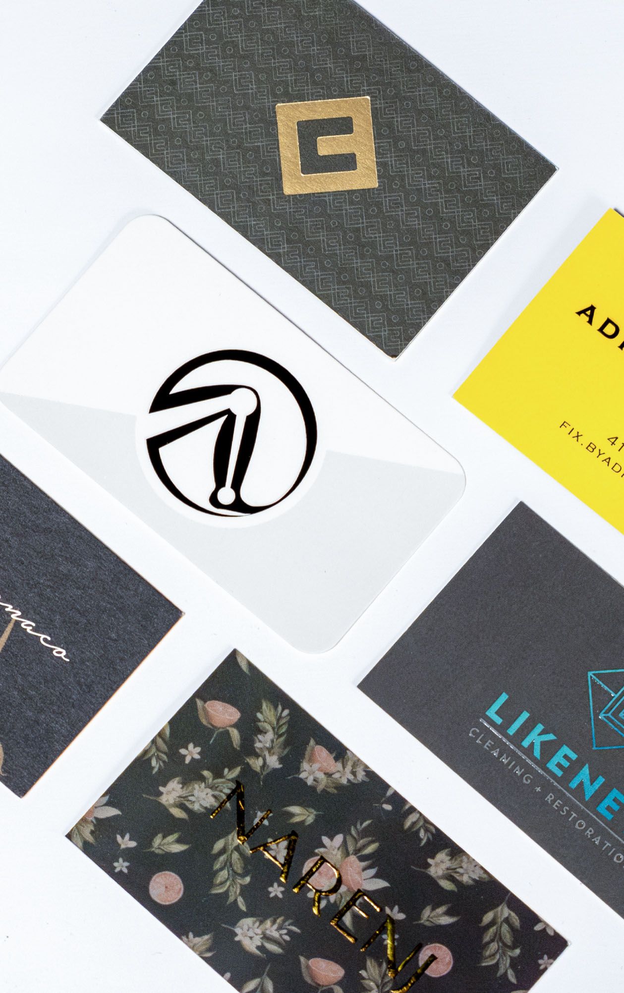 Business cards arranged on a light surface.