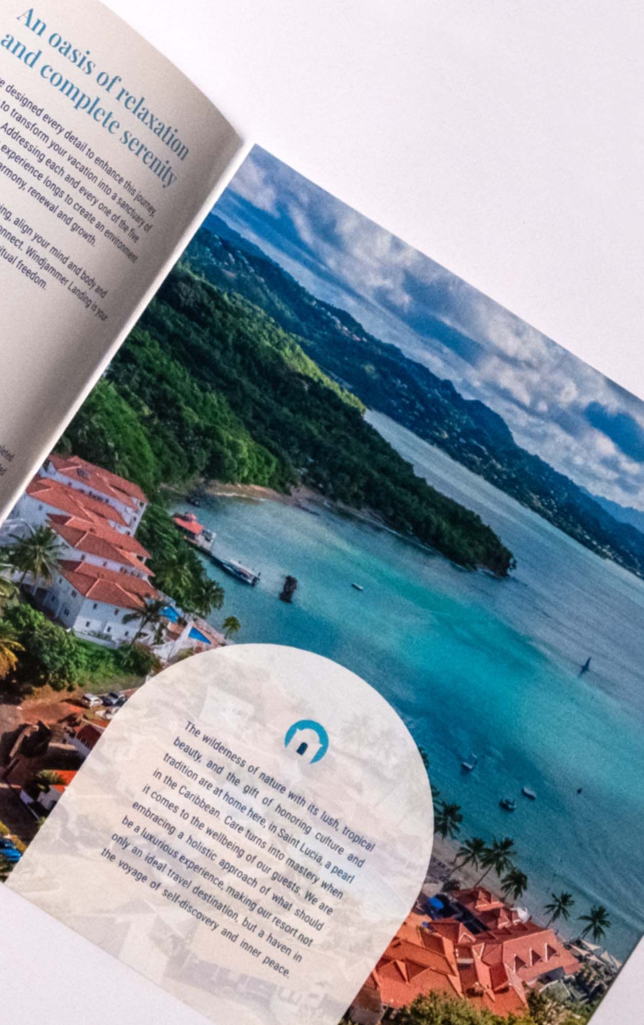 Open travel brochure featuring a Caribbean resort and coastal landscape.