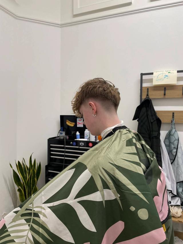 Curly textured crop with a low drop fade