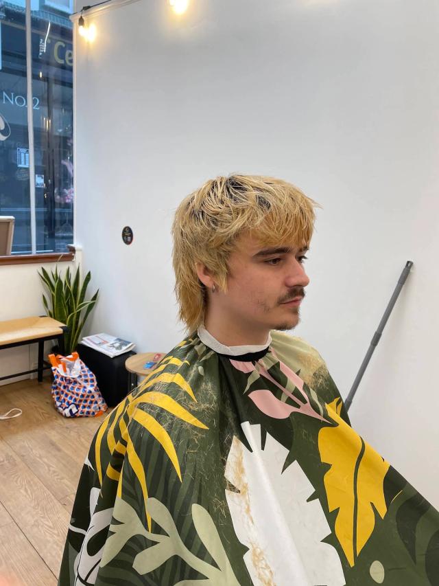 Blonde shaggy mullet by the front window