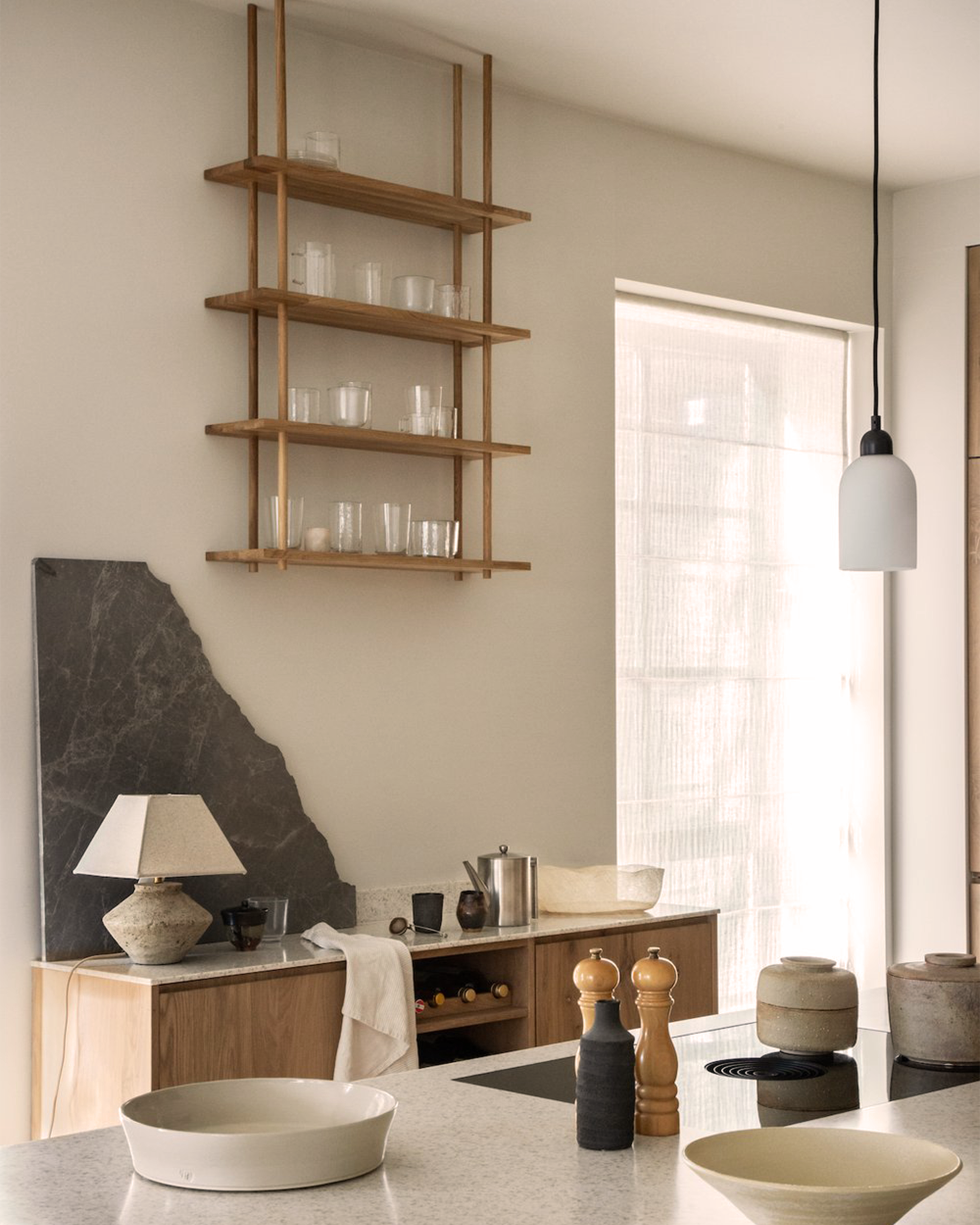 Bond Modular Shelving System mounted in the ceiling above the kitchen counter.
