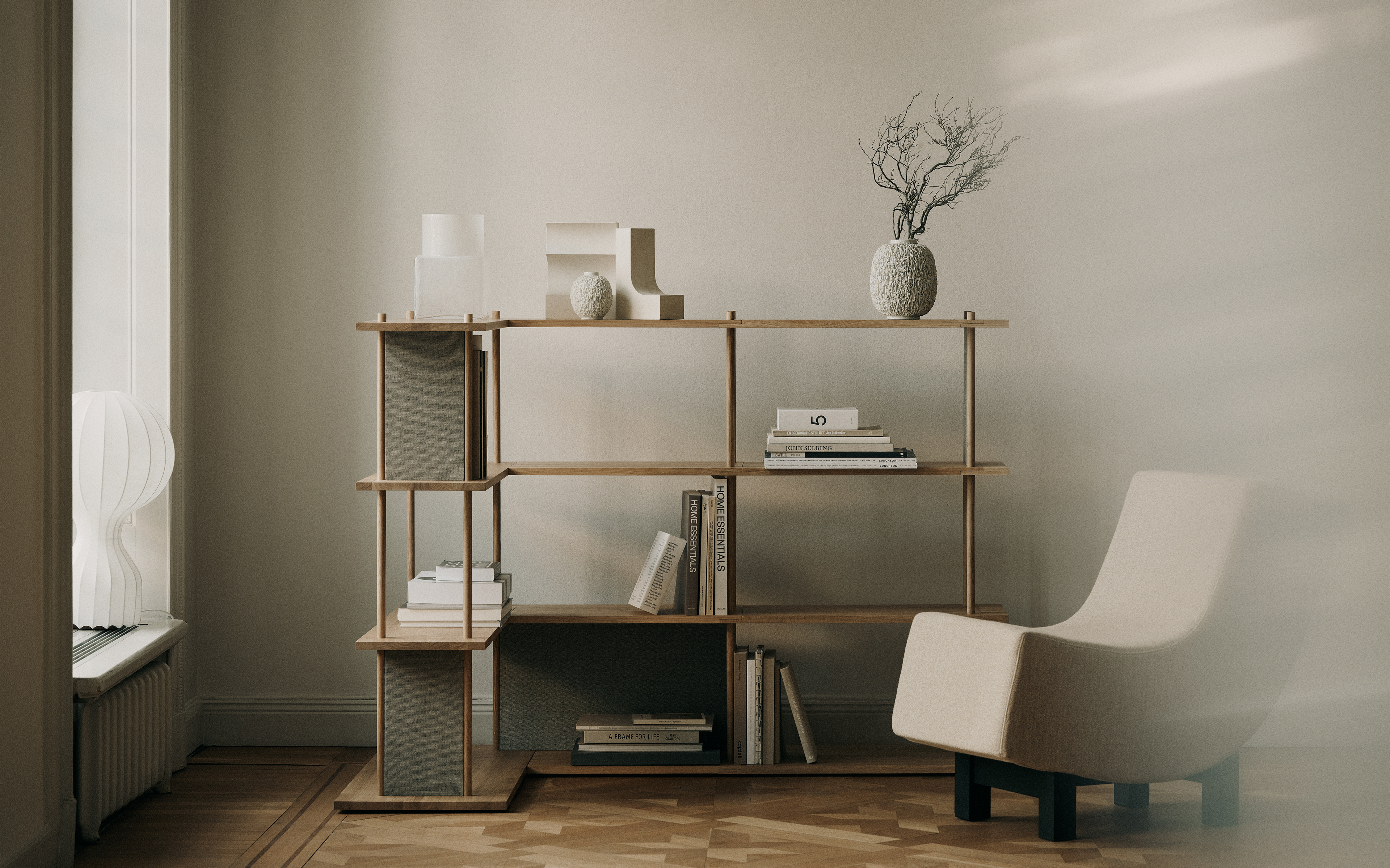 Fogia's Bond Modular Shelving System with BD1 Lounge Chair and Cube Vase Tall.