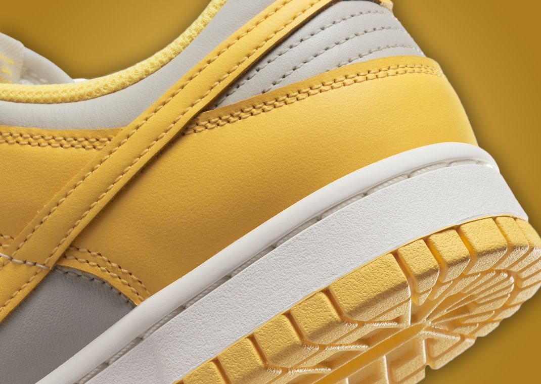 This Women's Nike Dunk Low Comes In Light Bone Citron Pulse