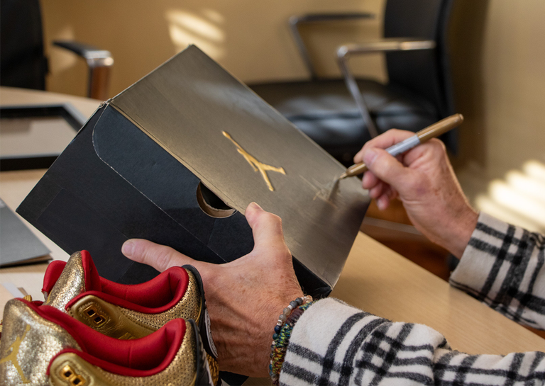 Tinker Hatfield Signing the Box for the Spike Lee x Air Jordan 3 Retro Gold Oscars PE