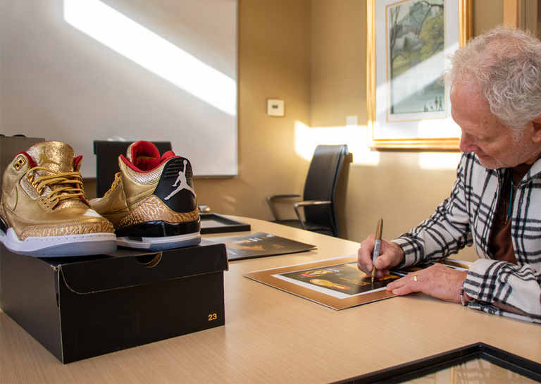 Tinker Hatfield Signing the artwork for the Spike Lee x Air Jordan 3 Retro Gold Oscars PE