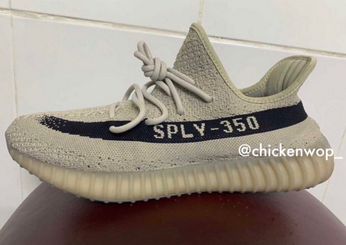 Black yeezy deals with tan stripe