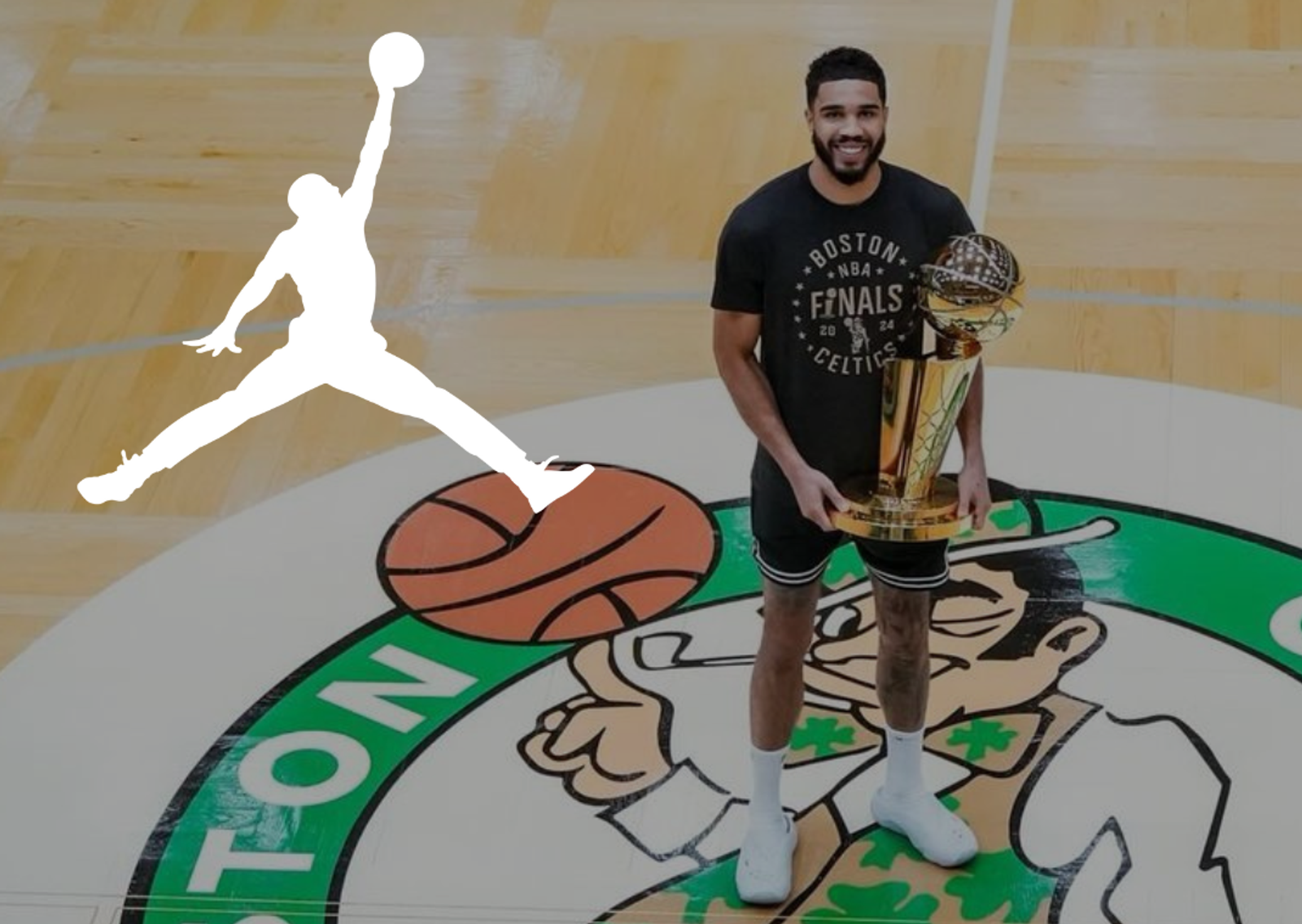 Jayson Tatum posing with the Larry O'Brien Trophy