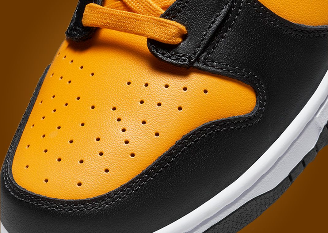 This Nike Dunk High Is Dressed In University Gold Black