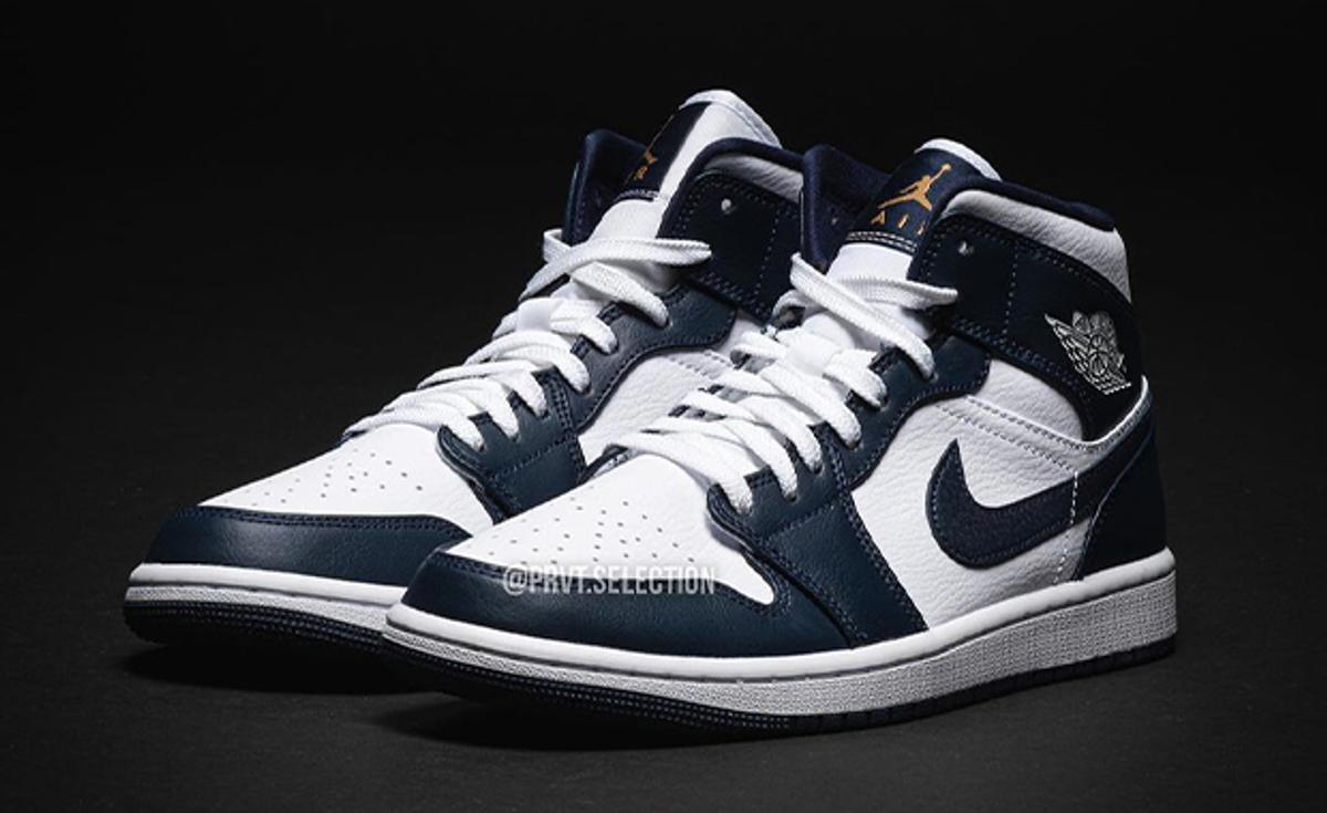 Obsidian Shades Come Accented By White And Gold On This Air Jordan 1 Mid
