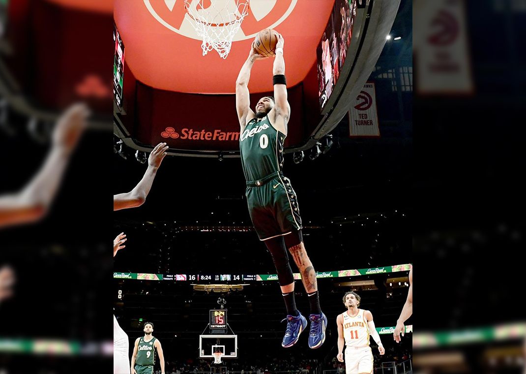 Boston Celtics center Robert Williams III (44) dunks as Miami Heat forward  Caleb Martin (16) and center Bam Adebayo (13) defend and guard Derrick  White watches during the first half in Game