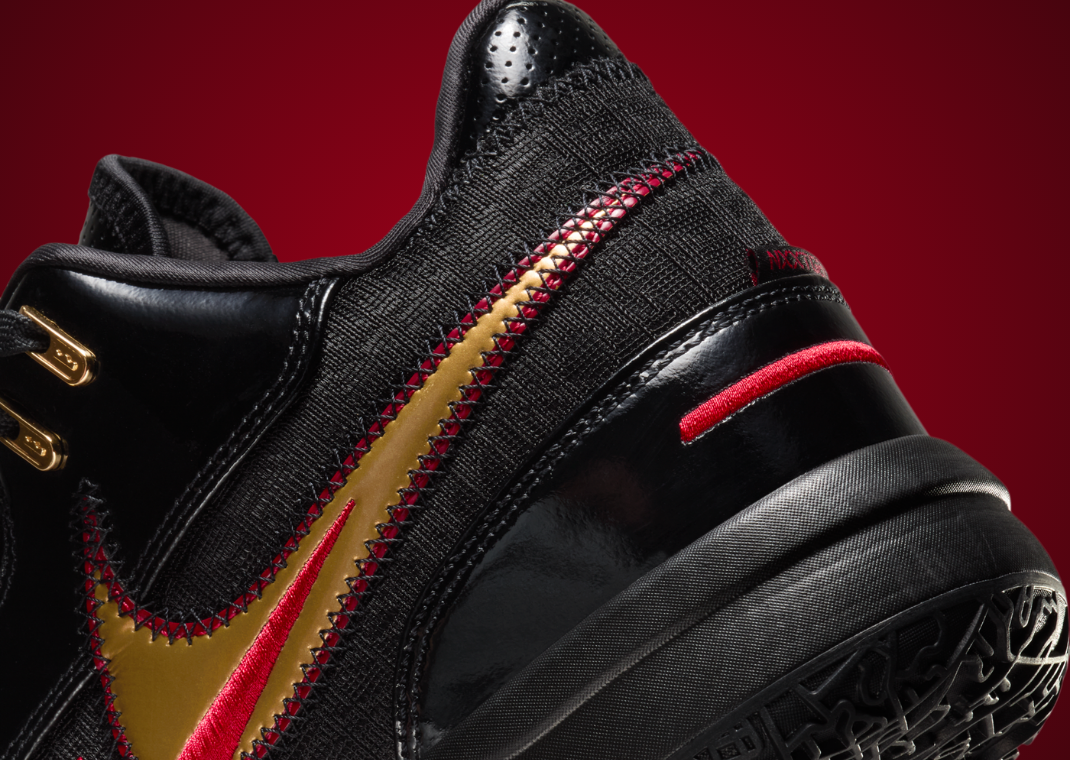 The Nike LeBron NXXT Gen Ampd Black Metallic Gold University Red
