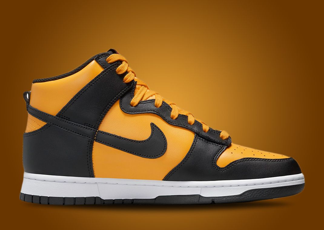 This Nike Dunk High Is Dressed In University Gold Black