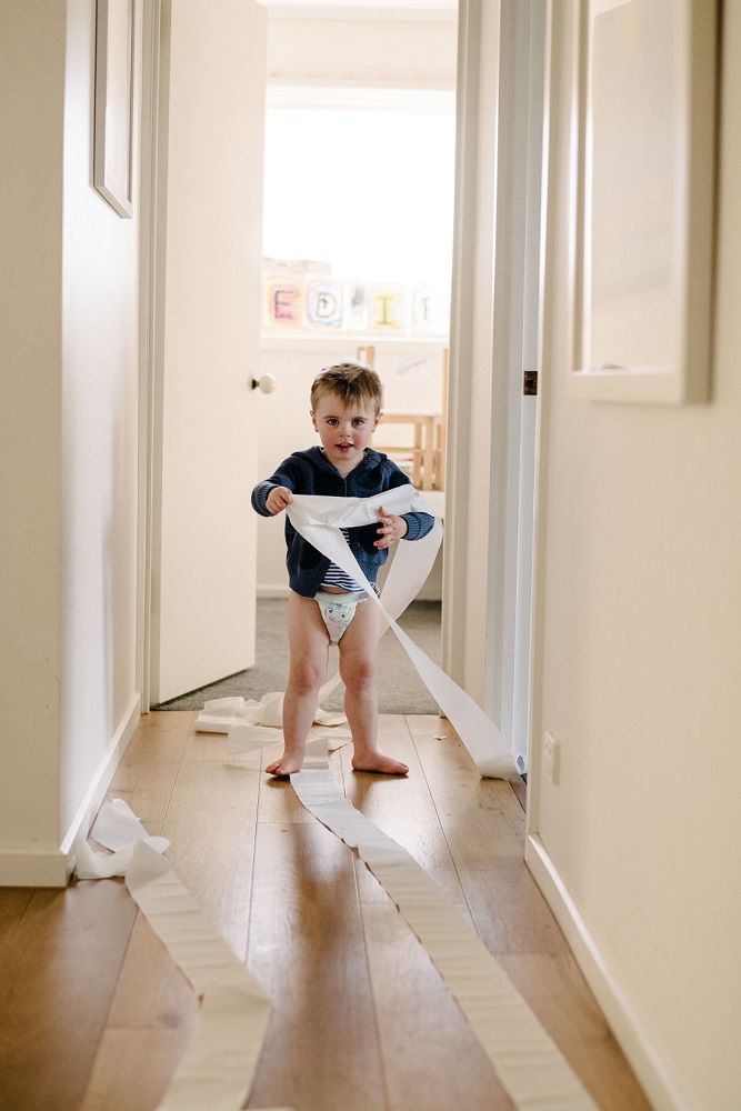 Young boy misbehaving during potty training 