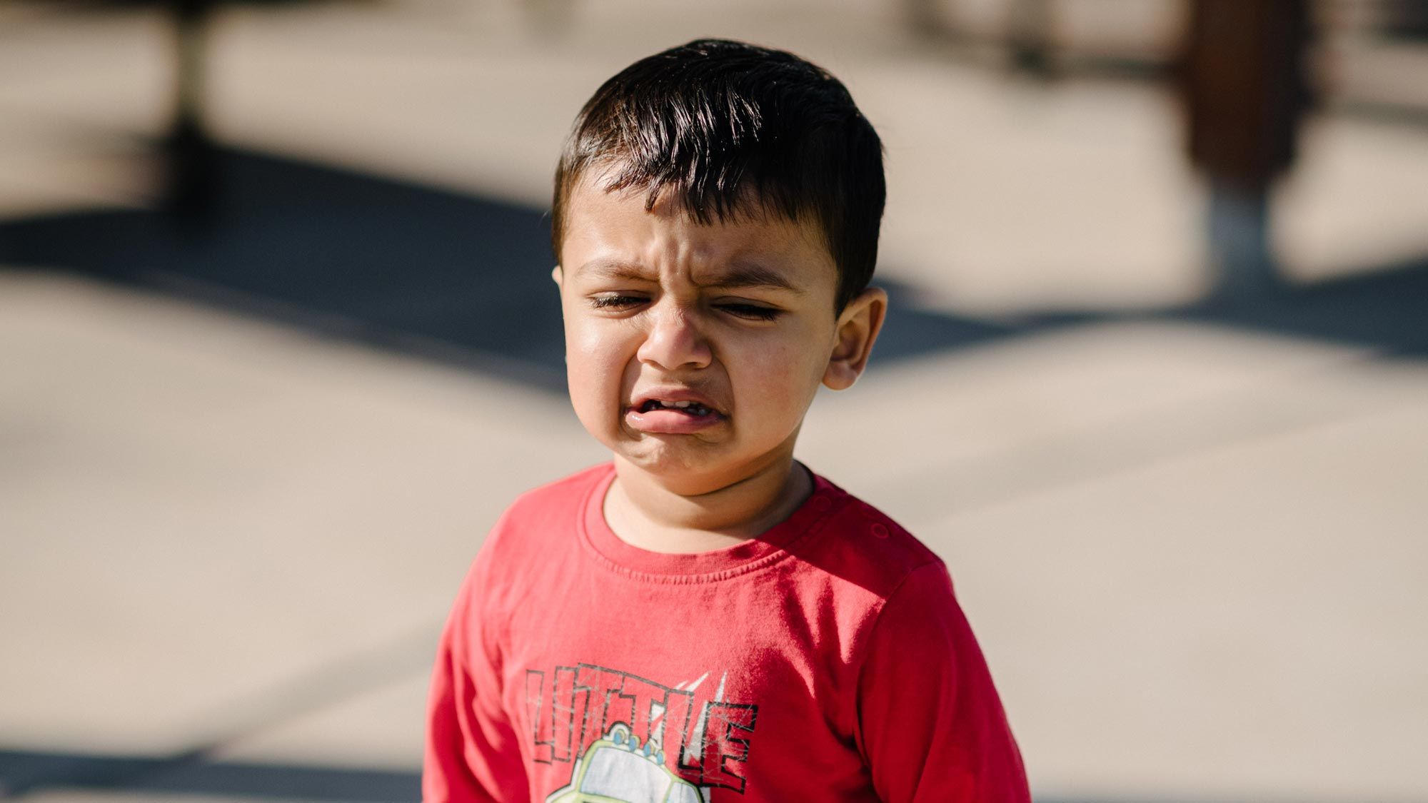 A young boy throwing a tantrum 