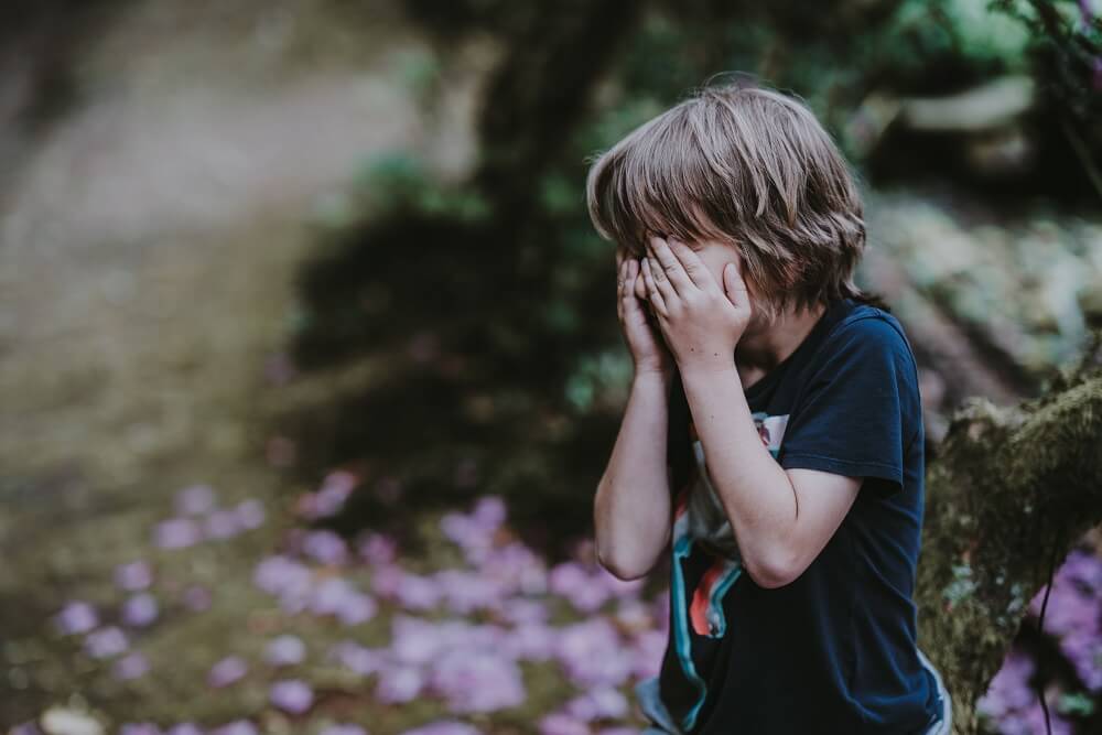 Child with moving anxiety crying.