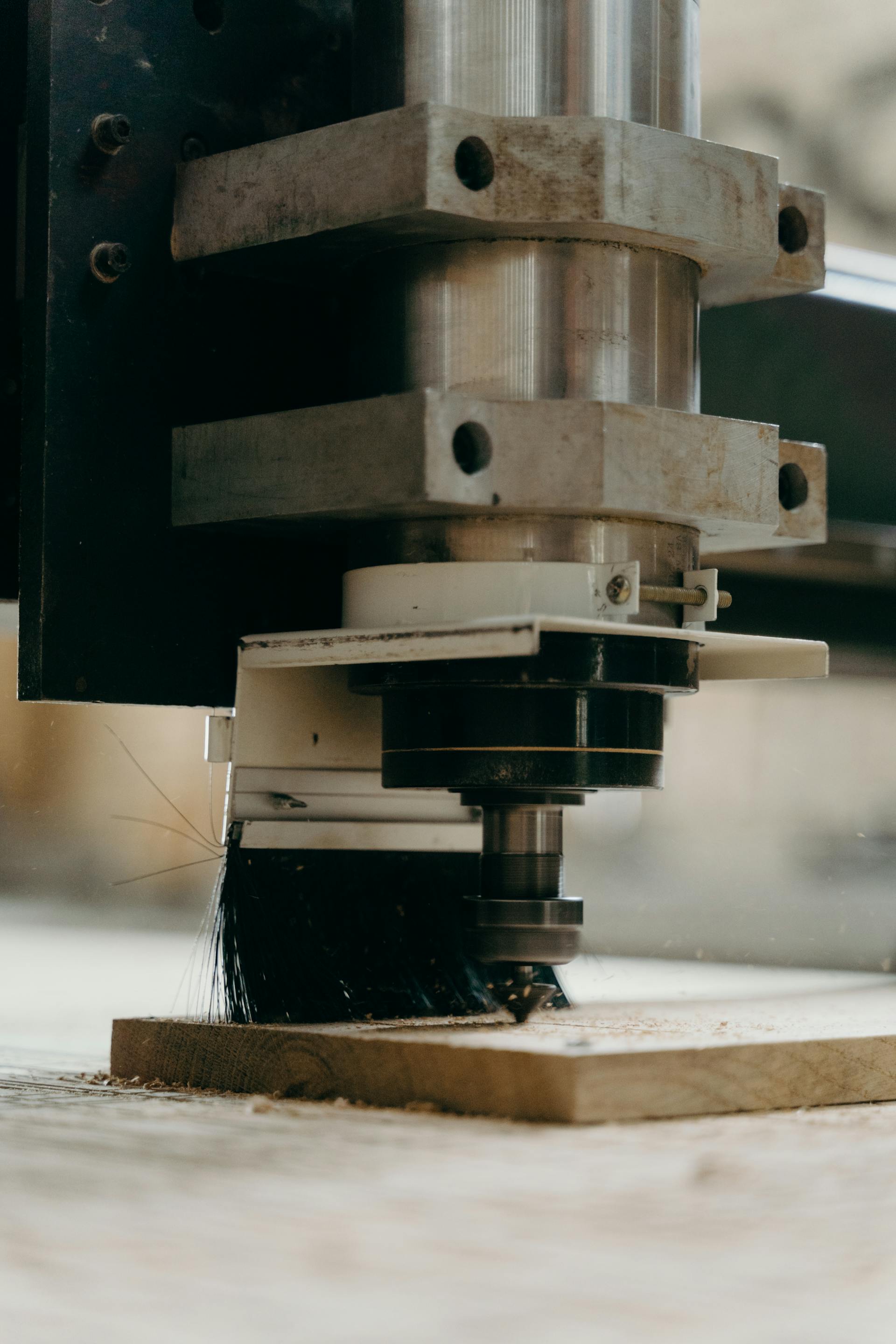CNC machine cutting and shaping a wood-based panel