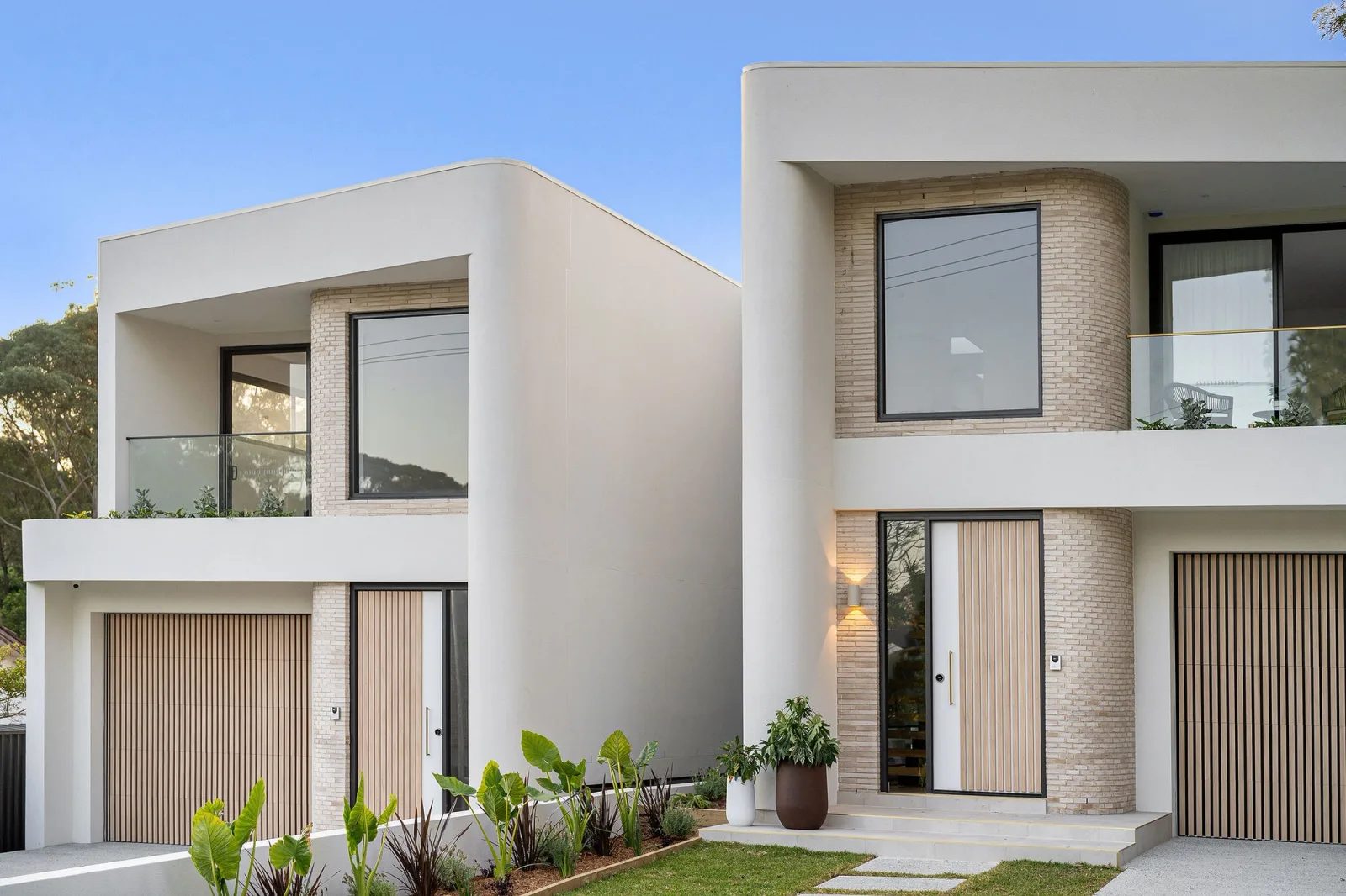 ELIPSE in East Ryde, curved pale brickwork and black-framed windows