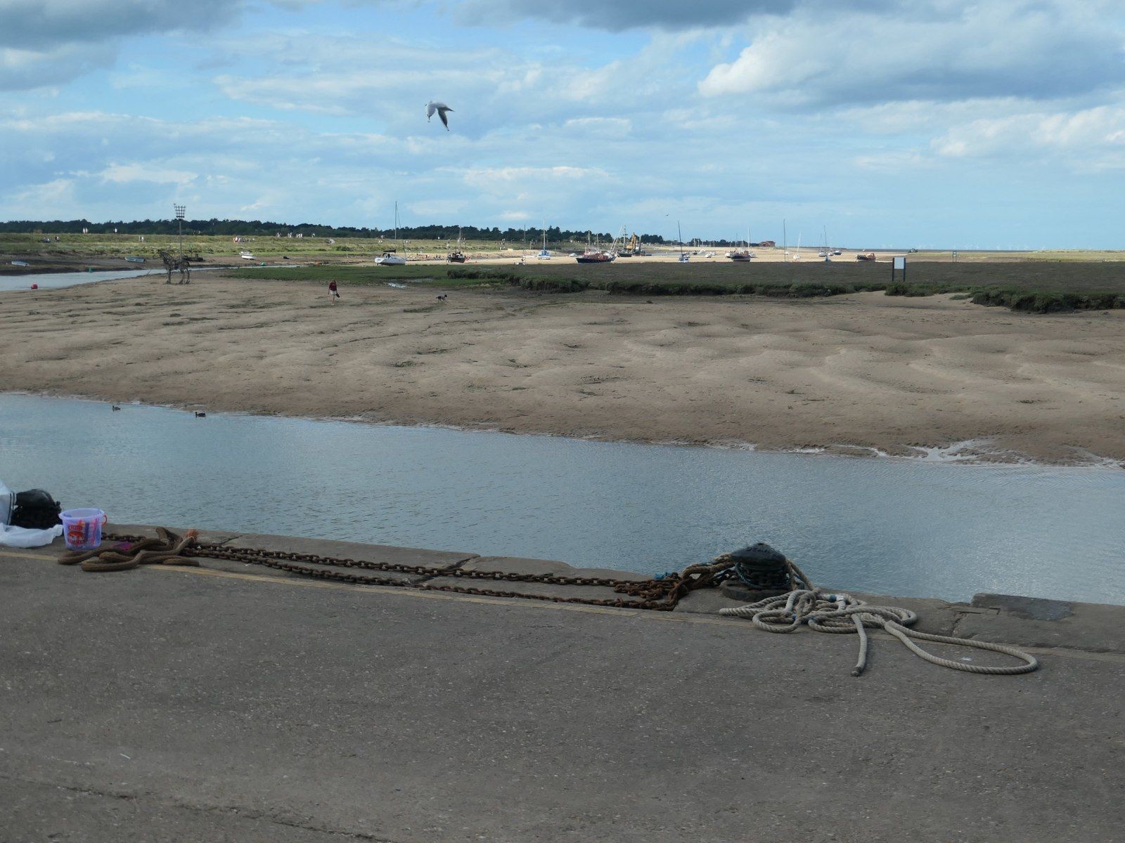 Harbour at Wells-next-the-Sea with exposed mudflats and moored boats just after low tide