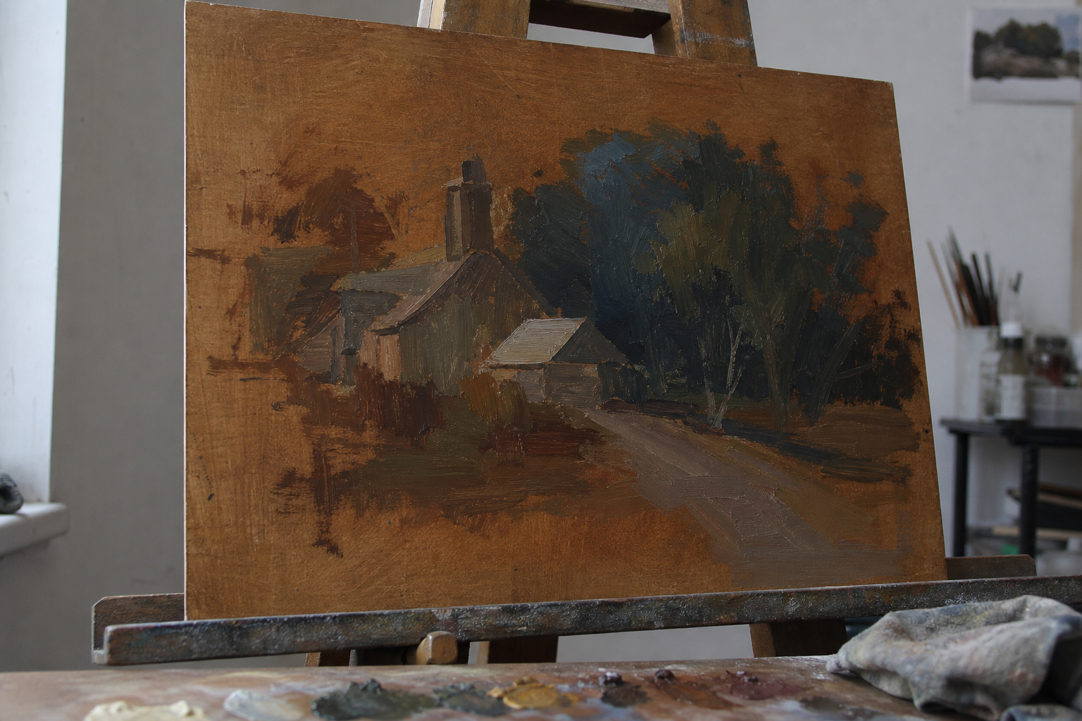 A toned brown panel with loose oil paint blocked in showing dark and mid tones