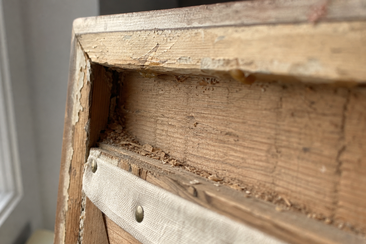 Close-up of a wooden picture frame showing the deep rebate channel interior