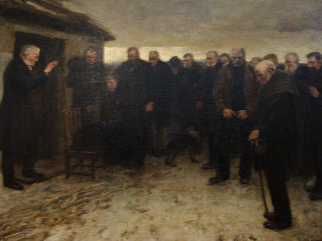 Painting titled 'A Highland Funeral' showing a group gathered for a funeral scene.