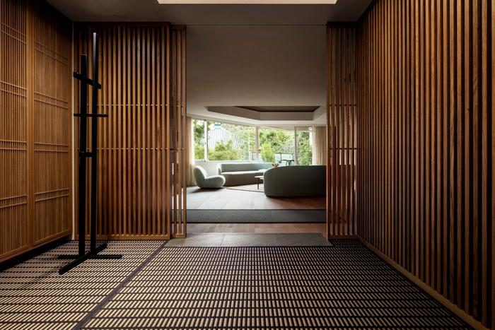 View from entrance to living space with woodnotes rug and louvres
