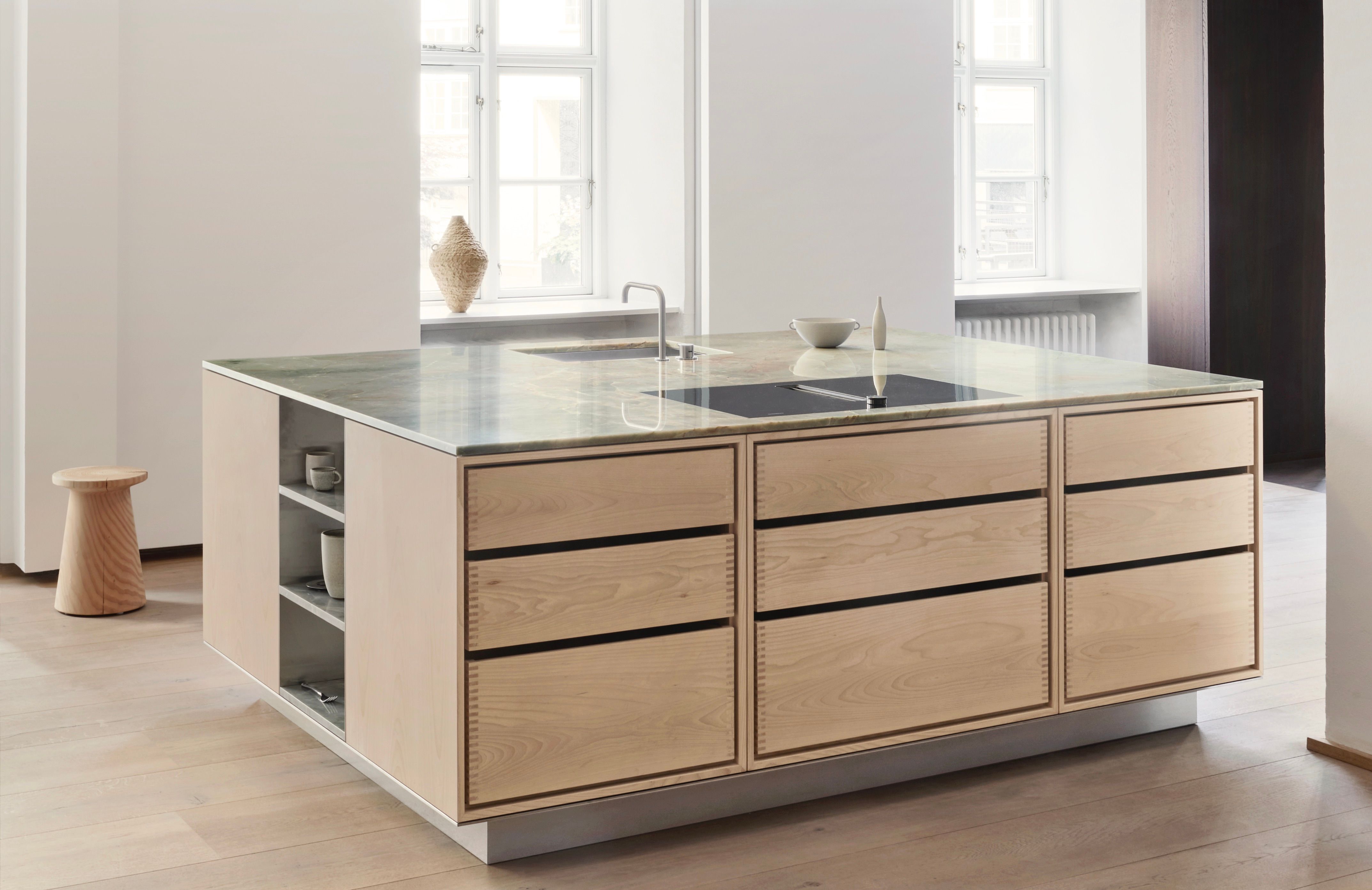 OEO Studio designed kitchen with quooker tap, steel vase and grey tiles