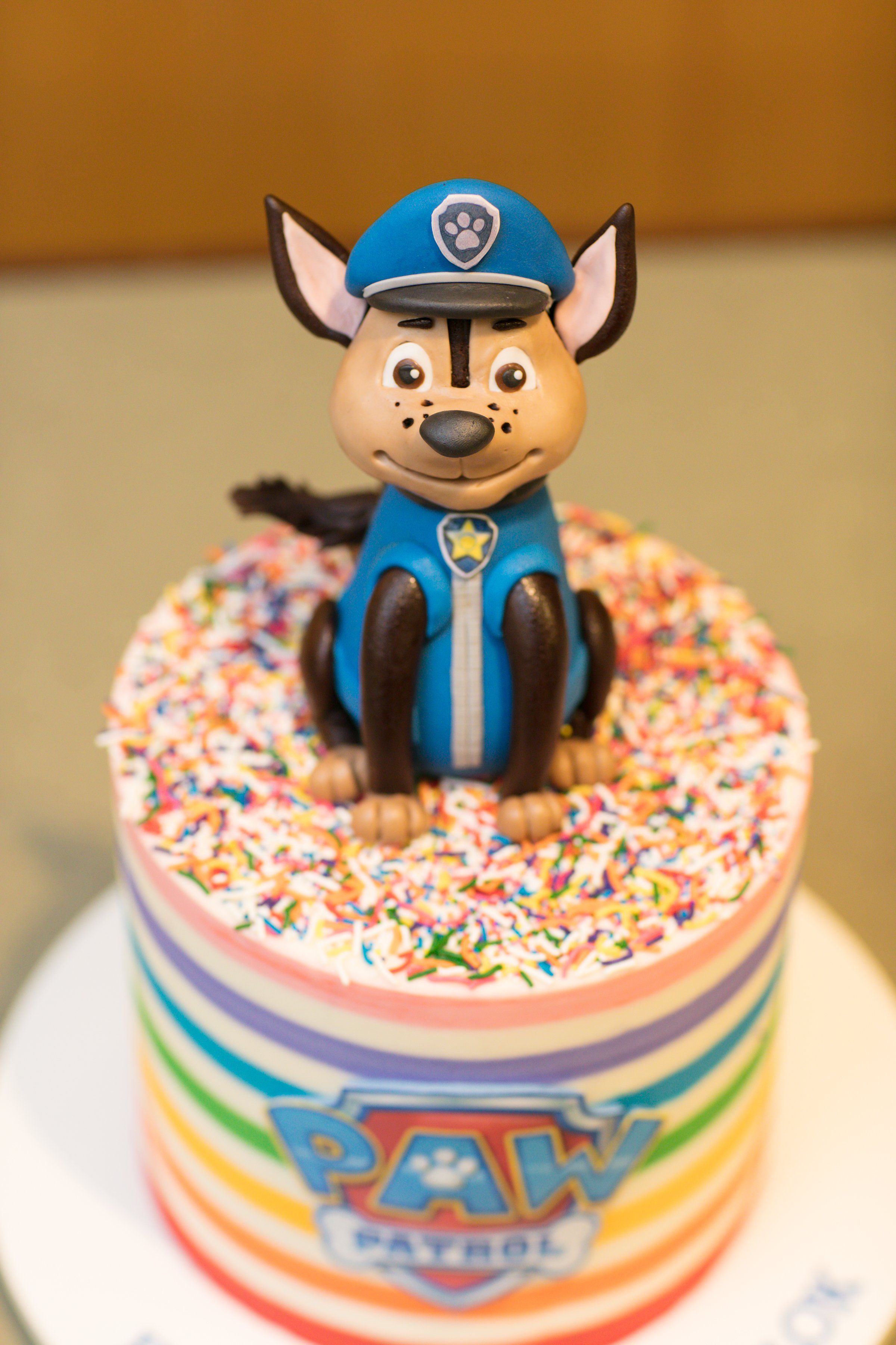Encanto Mirabel themed birthday cake with colorful flowers