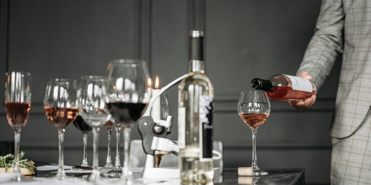 A table full of wine glasses and wine bottles.