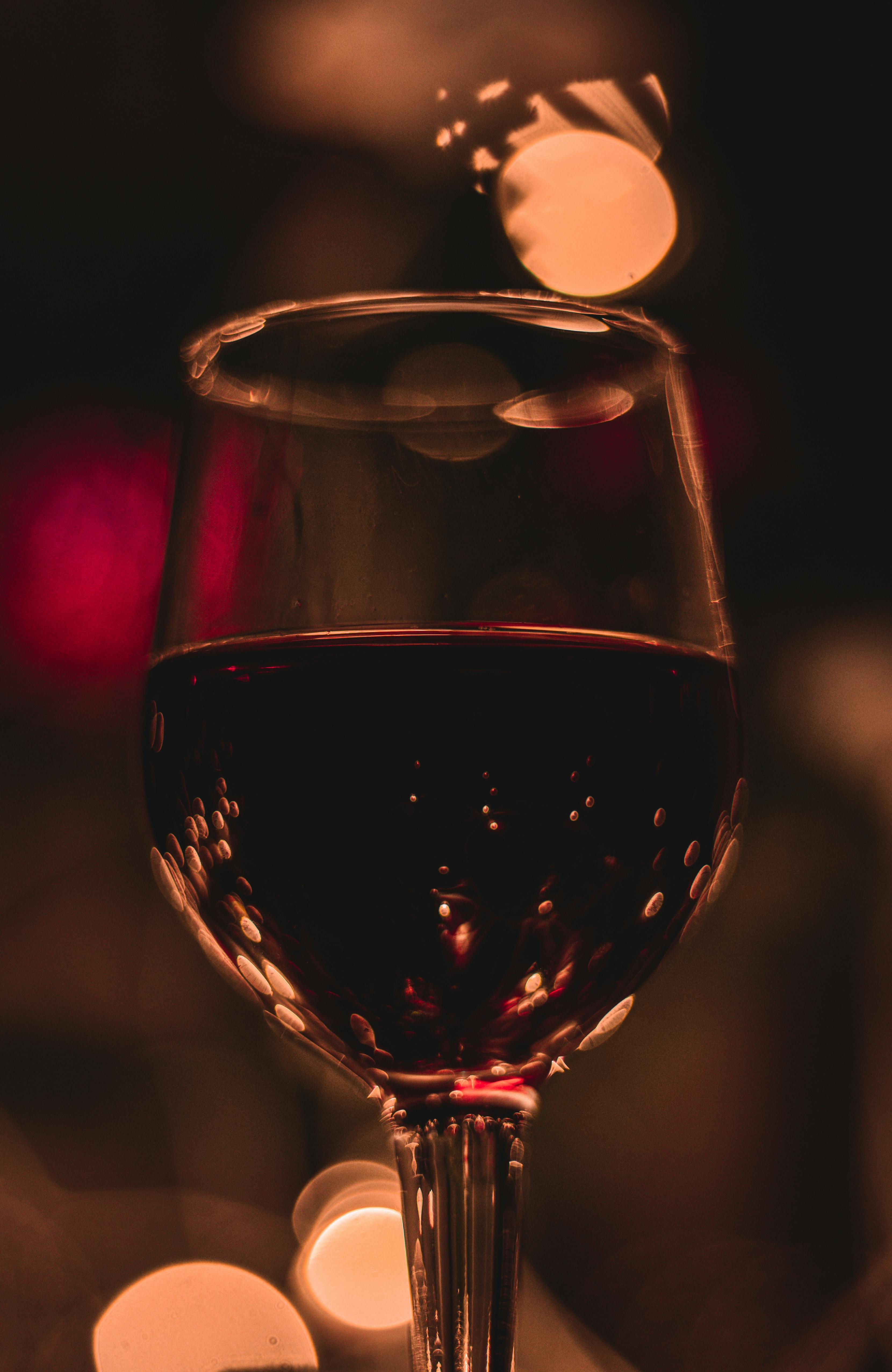 A closeup of a wine glass full of red wine.