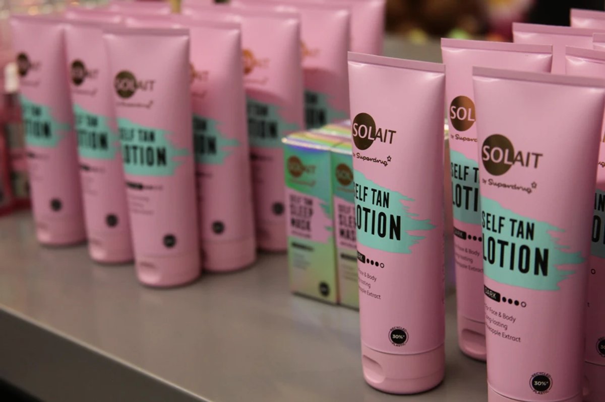 Several Solait beauty products on display in pink and blue packaging
