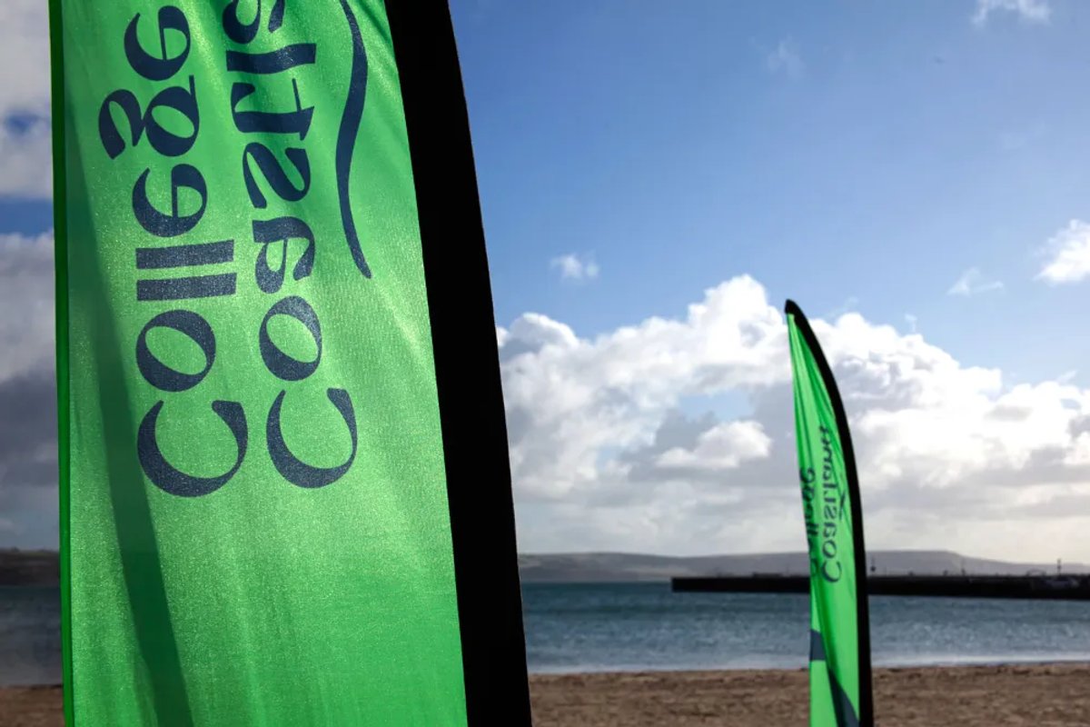 A flag printed with the Coastland College name