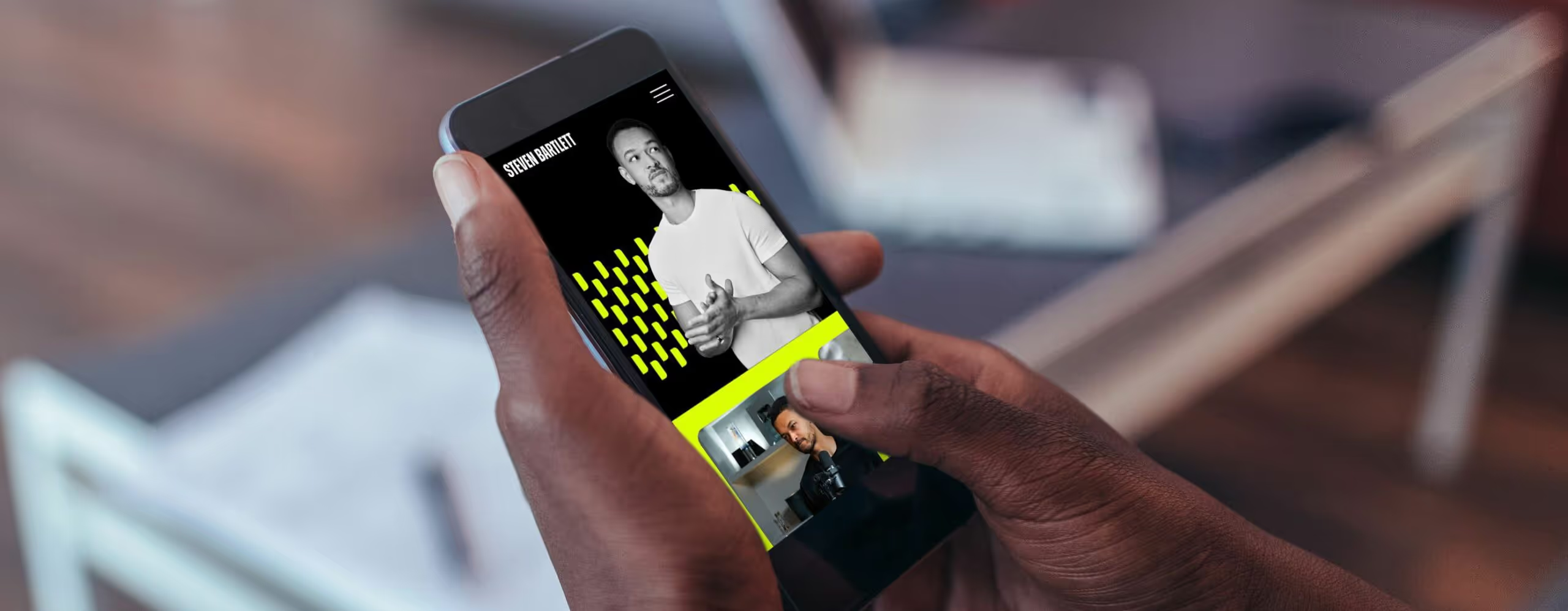 Someone using the Steven Bartlett website on their phone