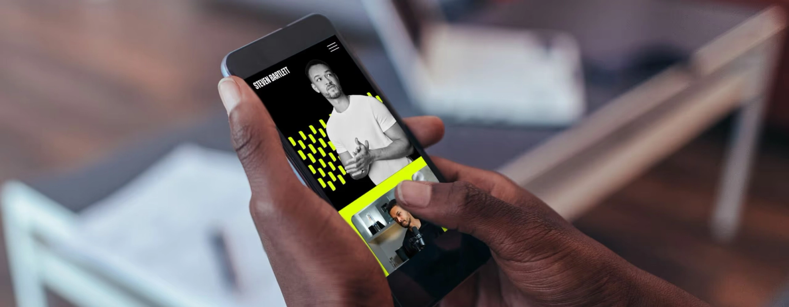Someone using the Steven Bartlett website on their phone