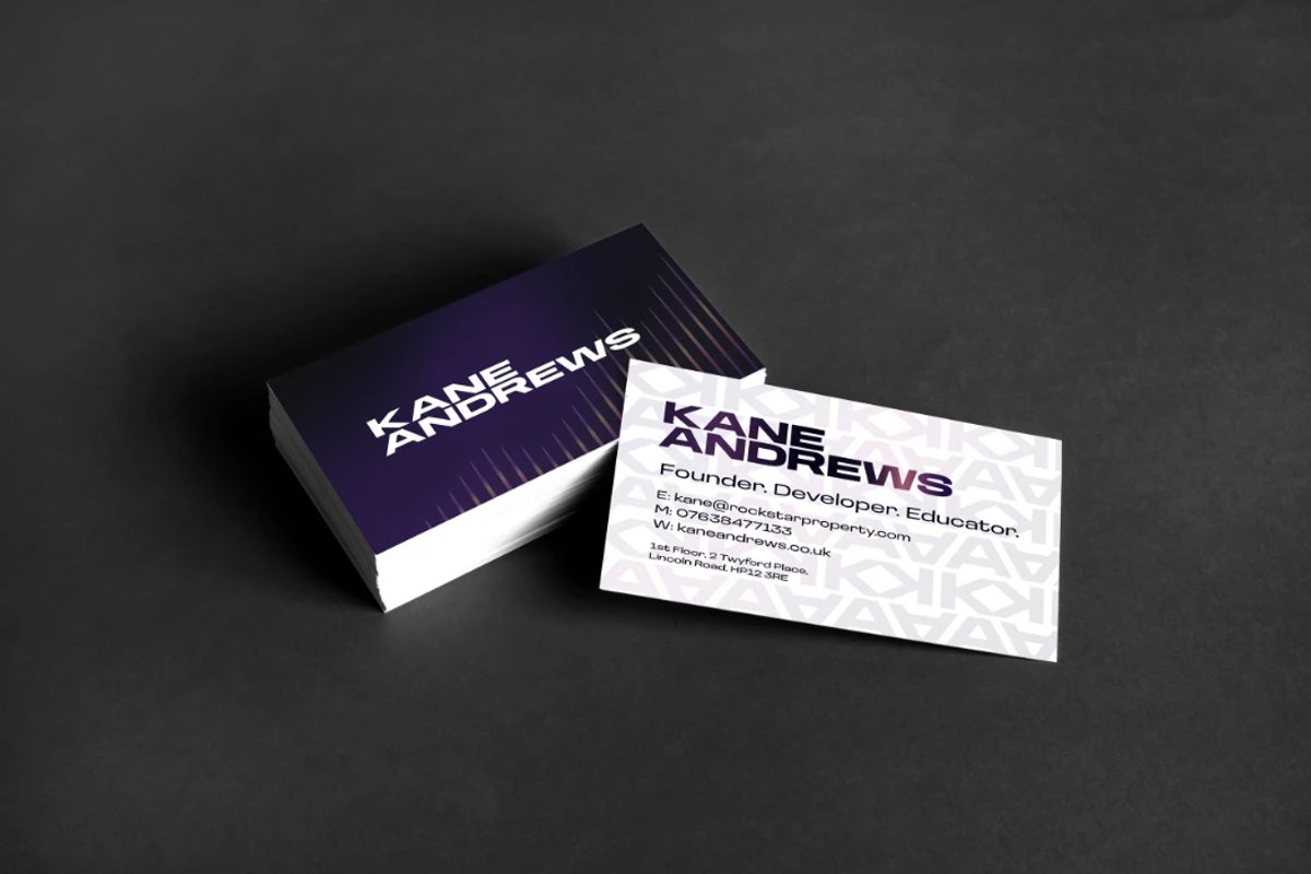 A stack of Kane Andrews business cards